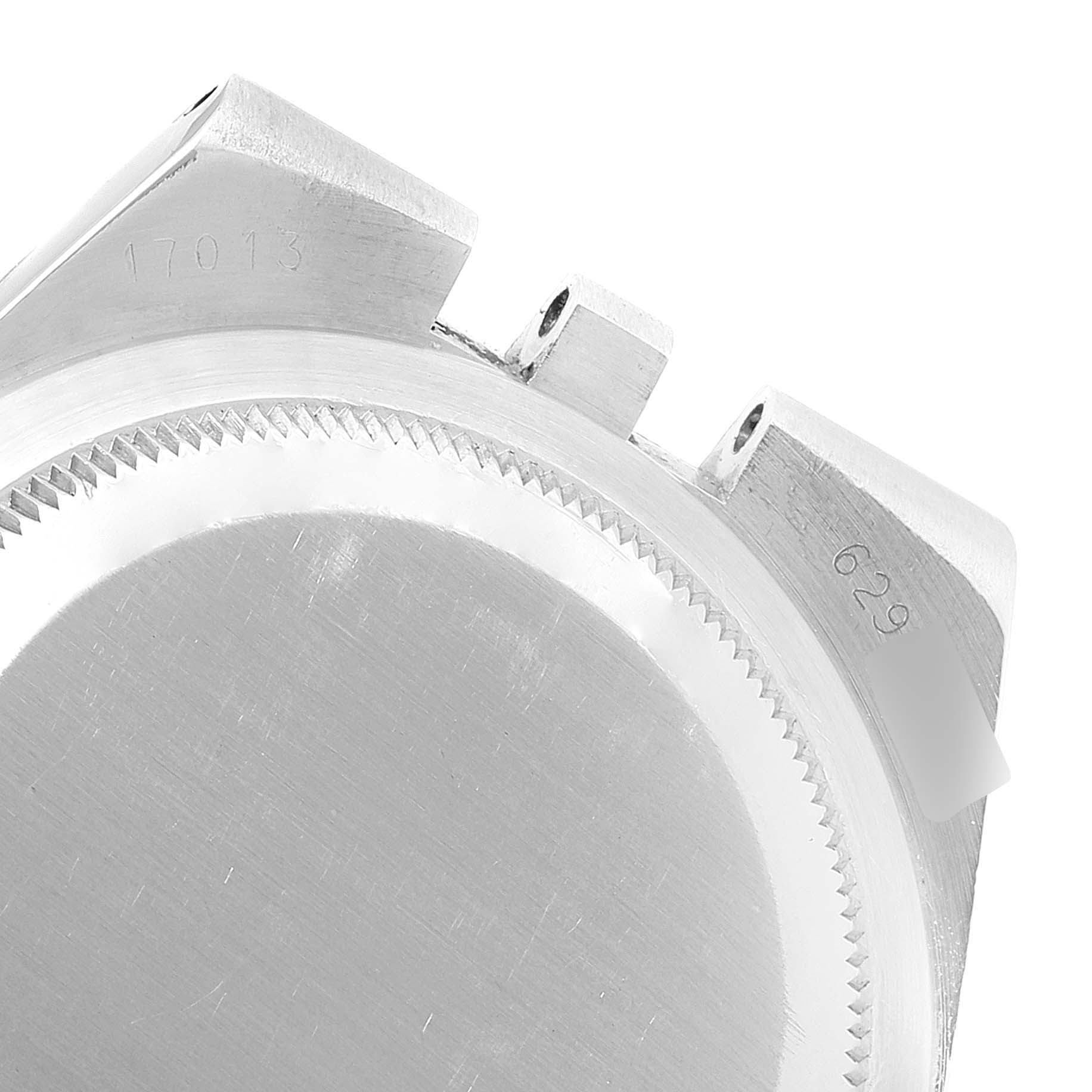 The image shows a top angle close-up of the case back and lugs of a Rolex Oysterquartz 17013 Men's Steel and Gold (two tone) Champagne Dial 17013 Men's Steel and Gold (two tone) Champagne Dial watch, with visible engravings.