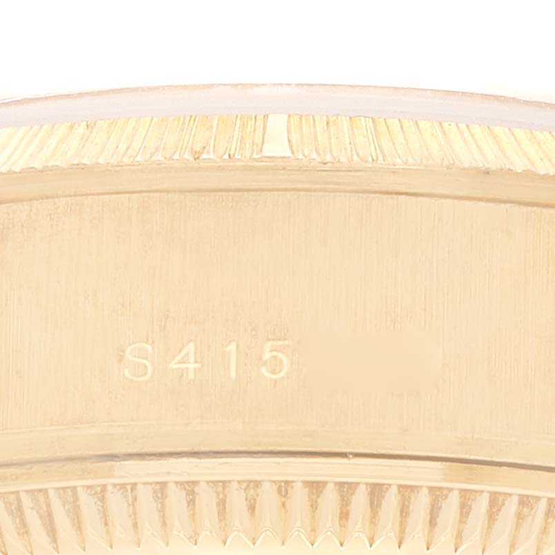 The image shows a close-up of the case back and fluted bezel of a Rolex President 69278 Women's Yellow Gold Beige Dial 69278 Women's Yellow Gold Beige Dial model watch.