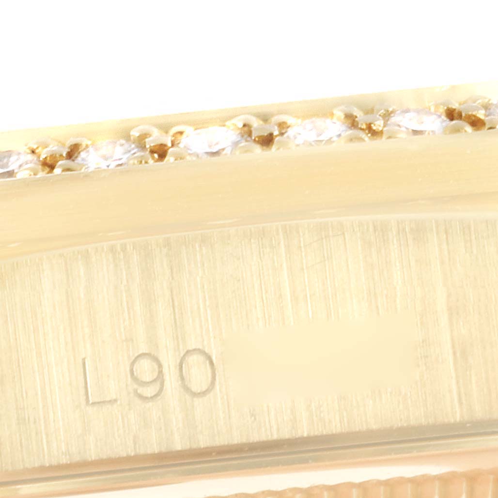 This image shows a partial close-up of the bezel and case side of a Rolex President 18388 Men
s Yellow Gold Black Dial 18388 Men
s Yellow Gold Black Dial model watch.