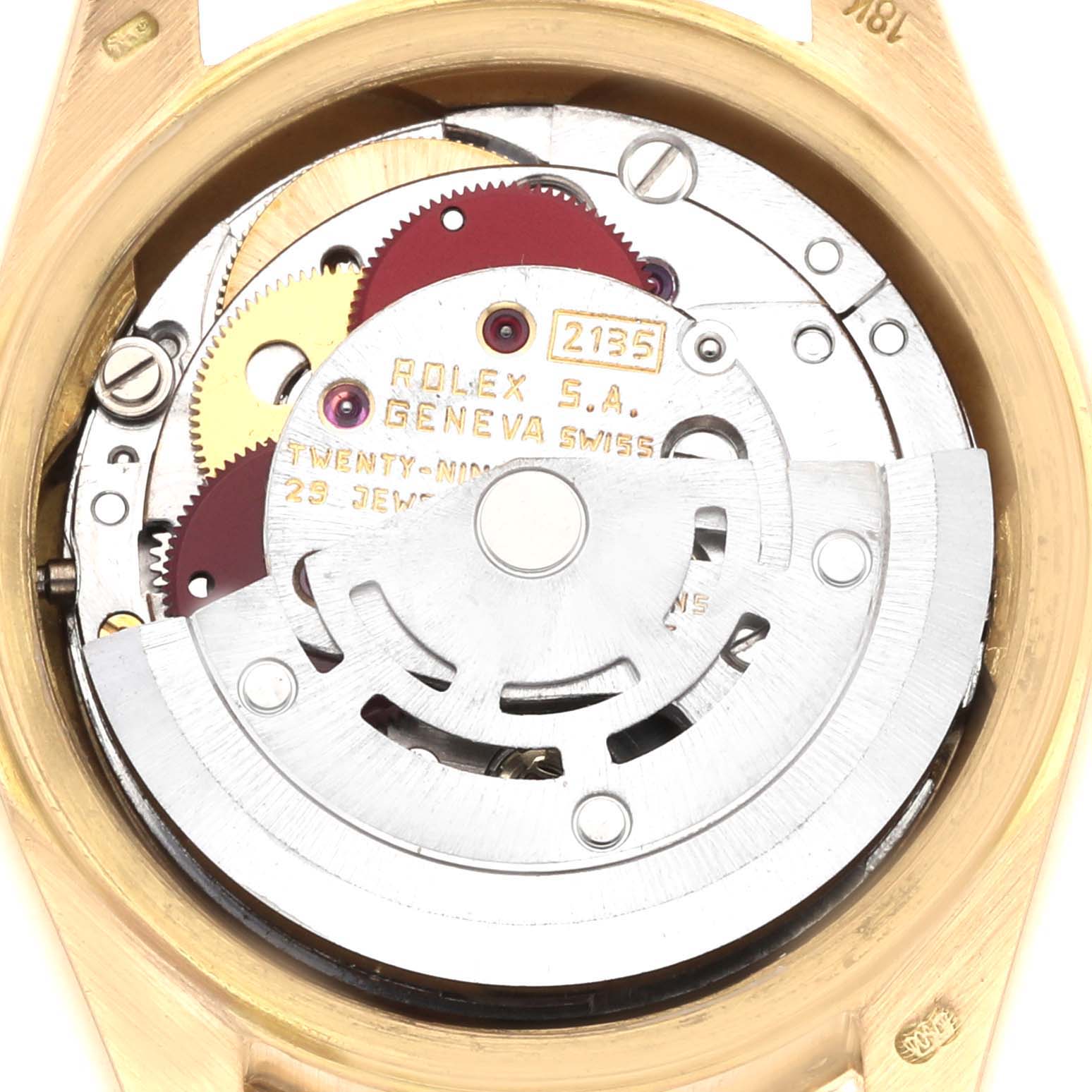 This image shows the movement mechanism of a Rolex President 69158 Women
s Yellow Gold Champagne Dial watch from the back, displaying gears and the rotor.