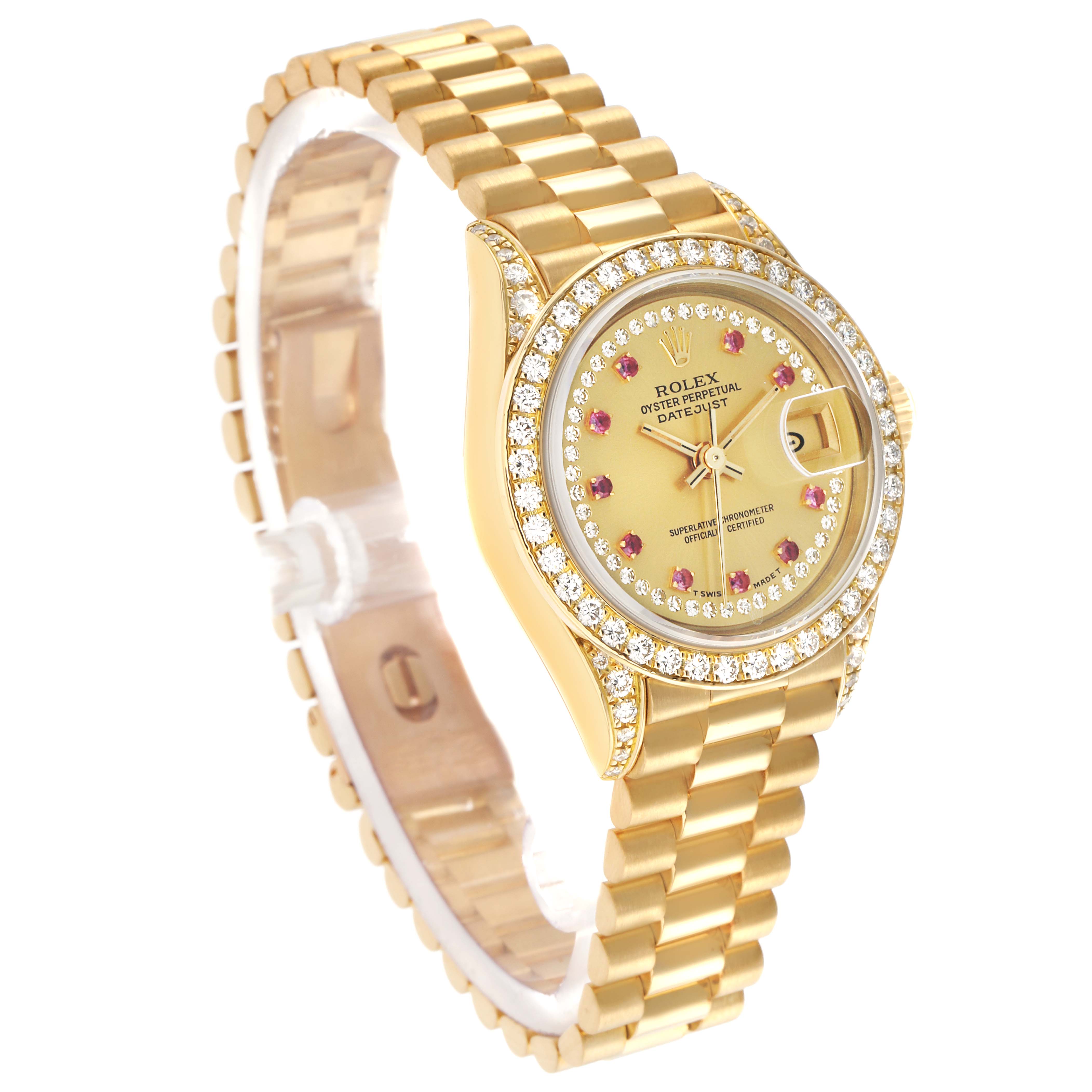 The Rolex President 69158 Women
s Yellow Gold Champagne Dial watch is shown at a three-quarter angle, highlighting the bracelet, bezel, and dial with diamond and ruby accents.