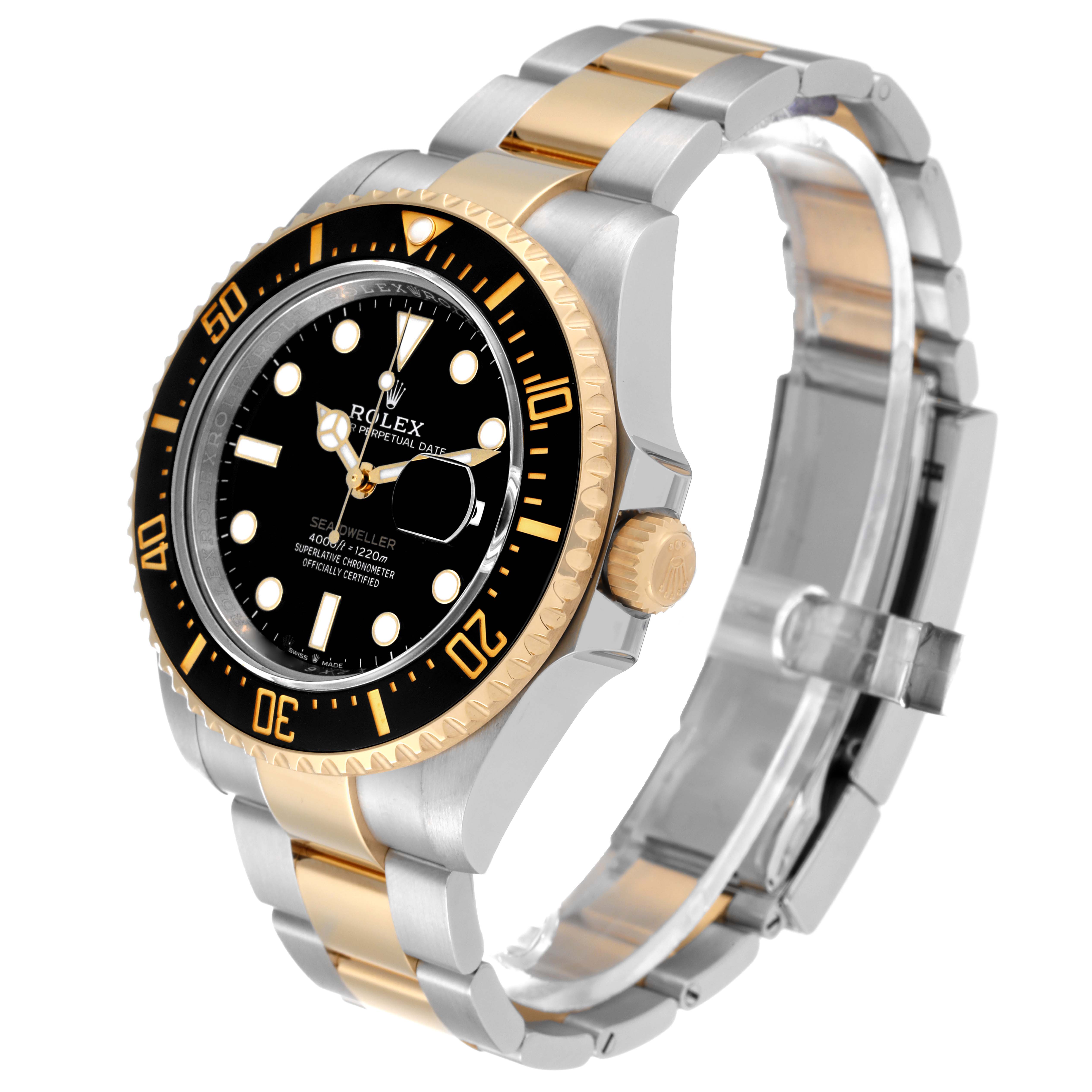 The image shows a Rolex Sea-Dweller 126603 Men
s Steel and Gold (two tone) Black Dial 126603 Men
s Steel and Gold (two tone) Black Dial watch at a three-quarter angle, highlighting the face, bezel, crown, and two-tone bracelet.