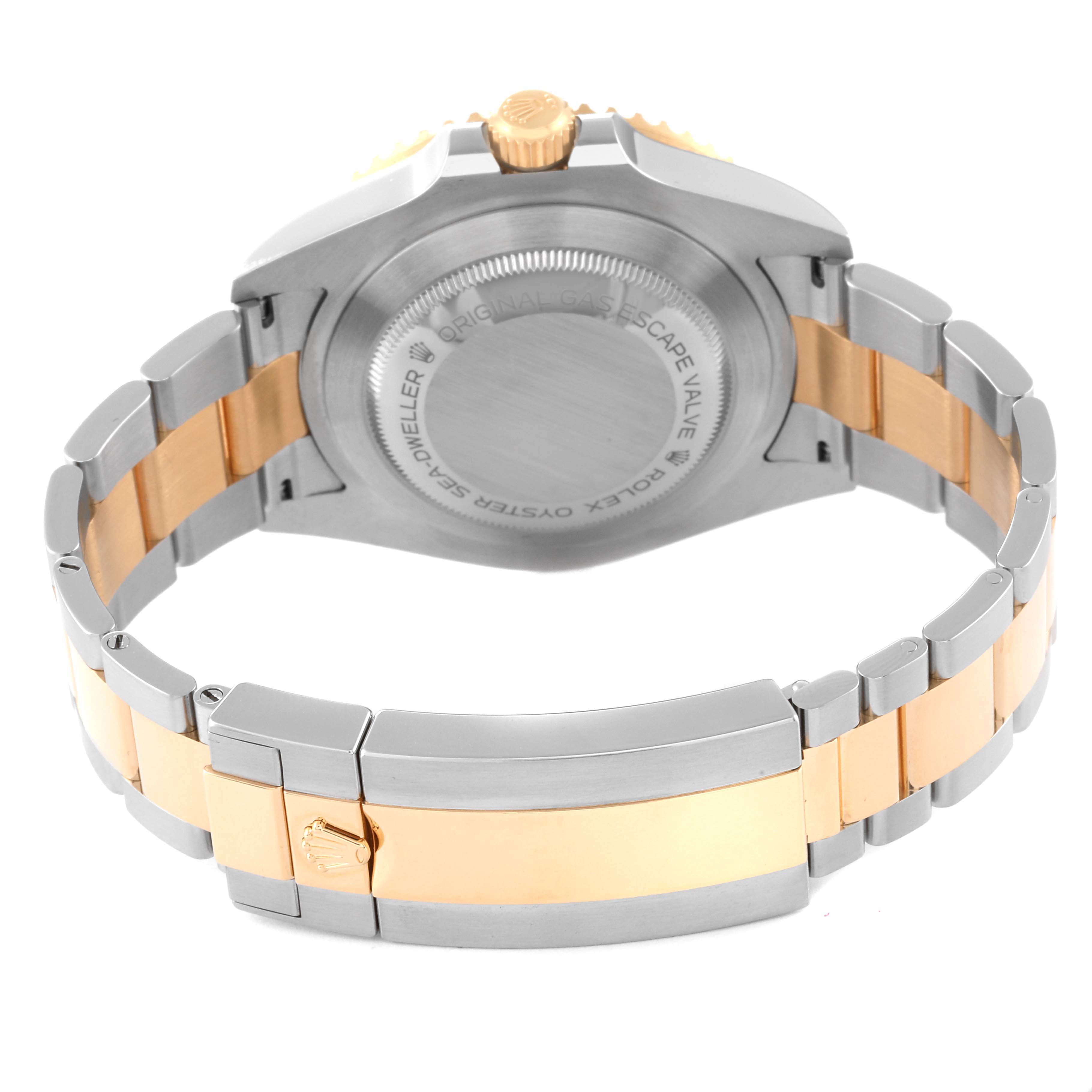 The image shows the back view of a Rolex Sea-Dweller 126603 Men
s Steel and Gold (two tone) Black Dial 126603 Men
s Steel and Gold (two tone) Black Dial watch, highlighting the case back, bracelet, and clasp.