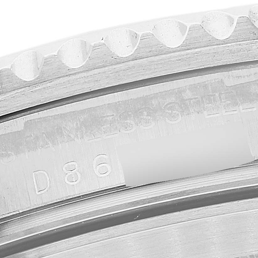 The image shows a close-up of the bezel and the inner rim with engraved text on the Rolex Submariner 16610 Men
s Stainless Steel Black Dial 16610 Men
s Stainless Steel Black Dial watch.