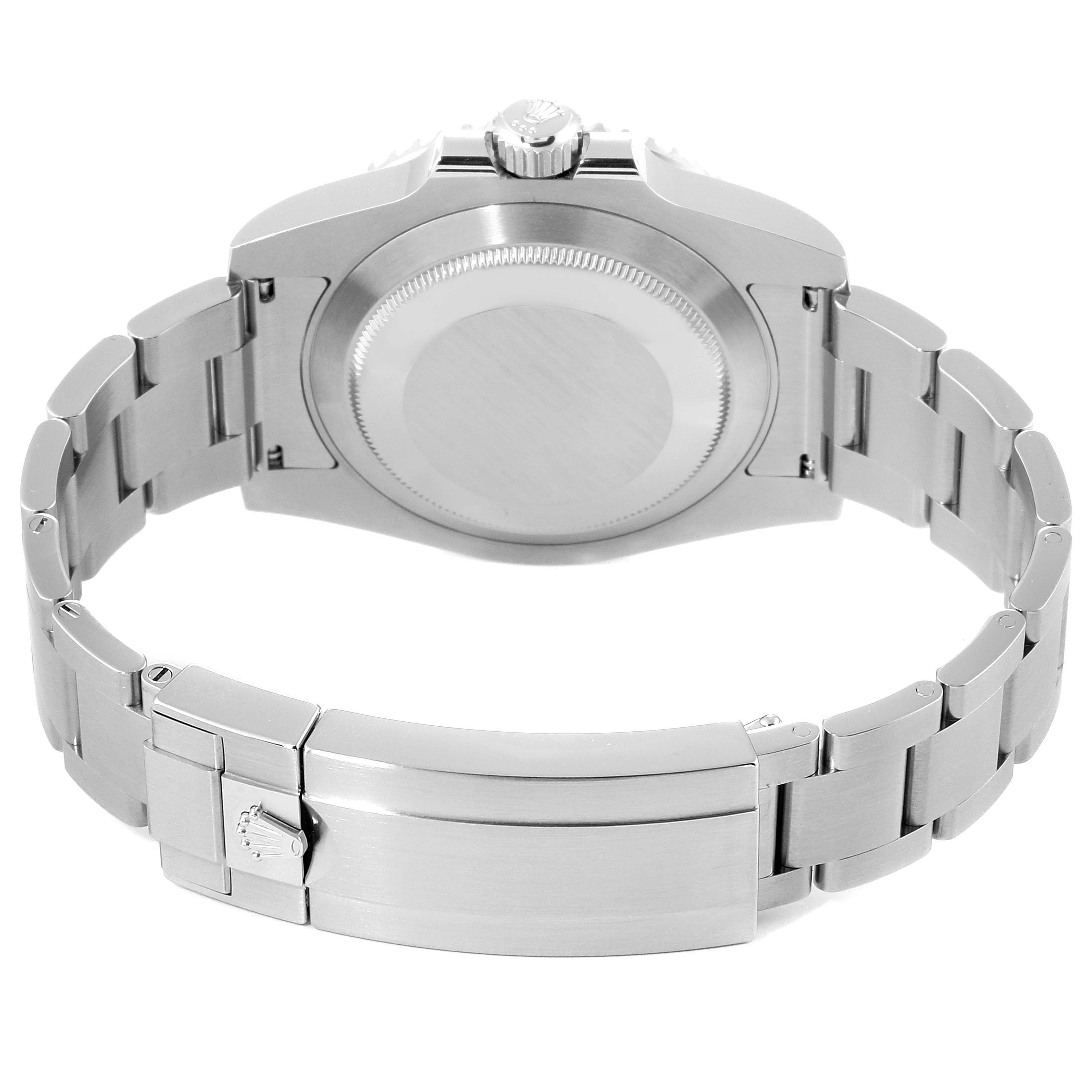 The image shows the rear view of the Rolex Submariner 116610LV Men
s Stainless Steel Green Dial 116610LV Men
s Stainless Steel Green Dial watch, focusing on its case back and stainless steel bracelet.