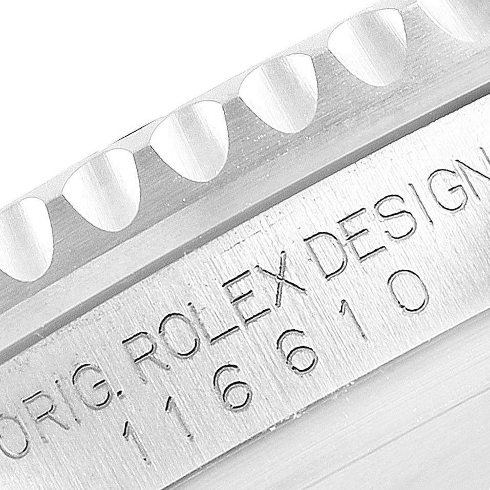 This close-up image of a Rolex Submariner 116610LV Men
s Stainless Steel Green Dial 116610LV Men
s Stainless Steel Green Dial watch shows part of the engraved bezel and the case with the model number 116610.