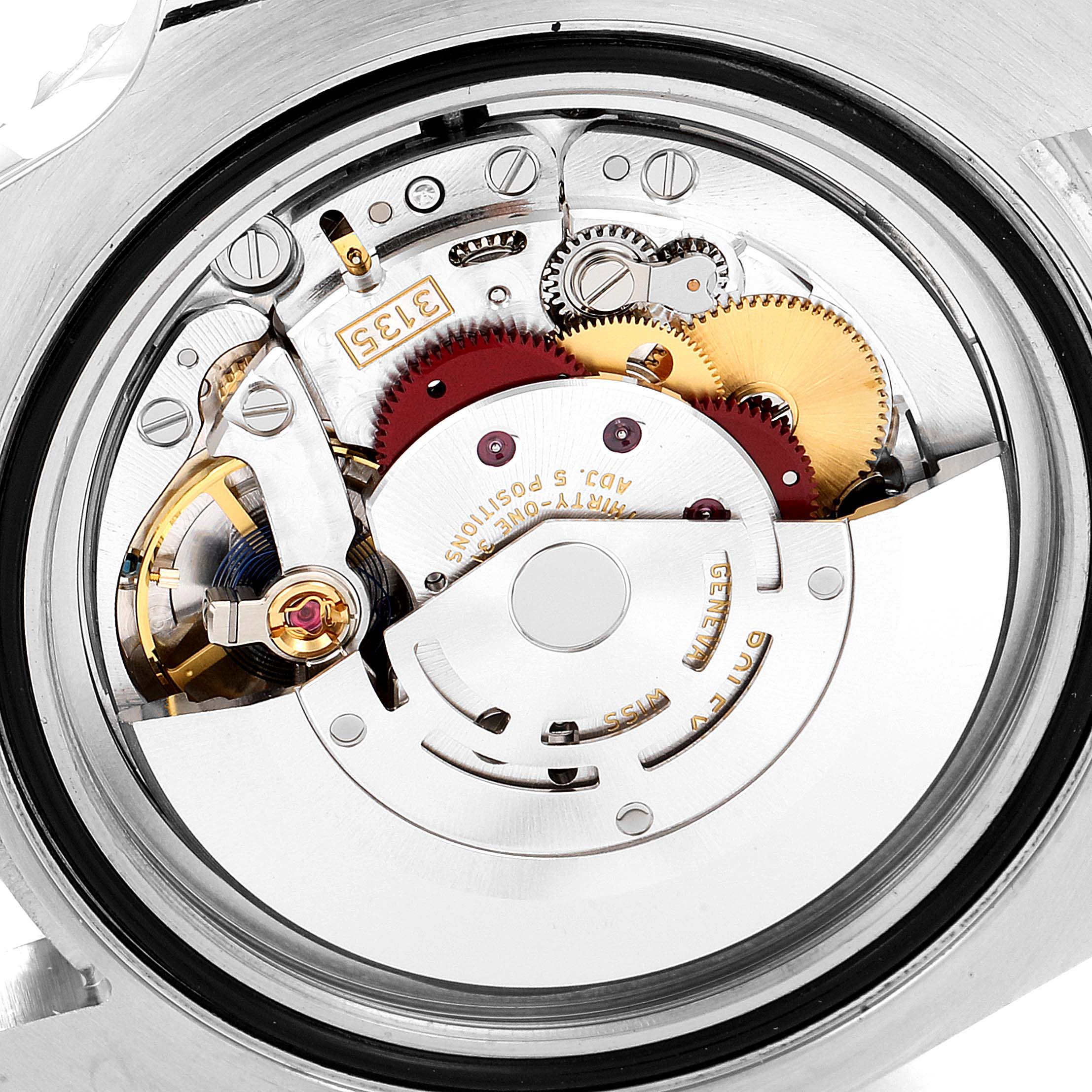 The image shows a close-up of the movement mechanism of a Rolex Submariner 116610LV Men
s Stainless Steel Green Dial 116610LV Men
s Stainless Steel Green Dial watch.