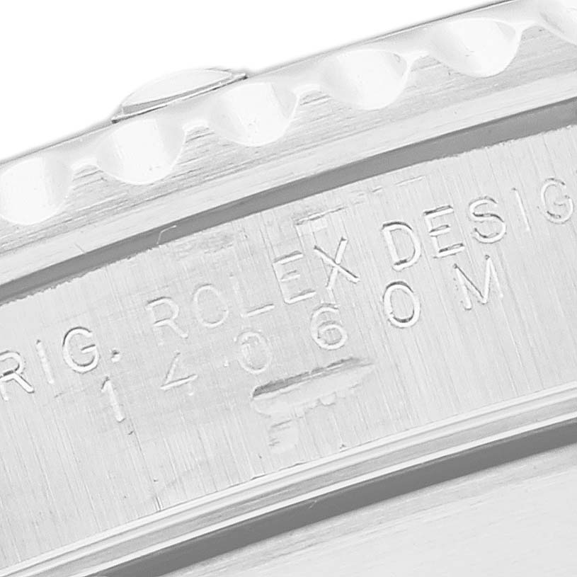 The image shows the side engraving of the Rolex Submariner 14060 Men
s Stainless Steel Black Dial 14060 Men
s Stainless Steel Black Dial watch.