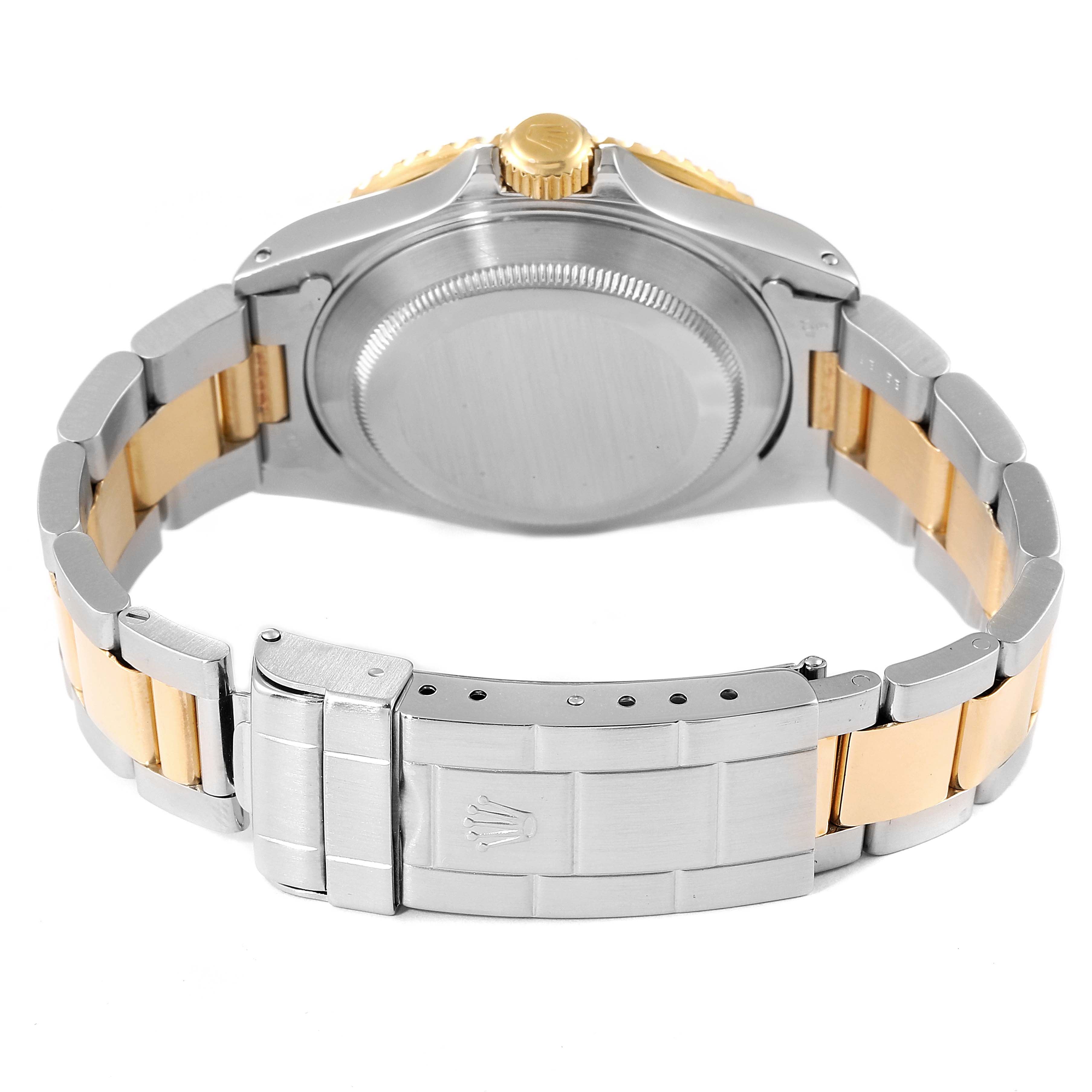 This image shows the back case, crown, and bracelet clasp of a Rolex Submariner 16613 Men's Steel and Gold (two tone) Black Dial 16613 Men's Steel and Gold (two tone) Black Dial watch from a rear angle.