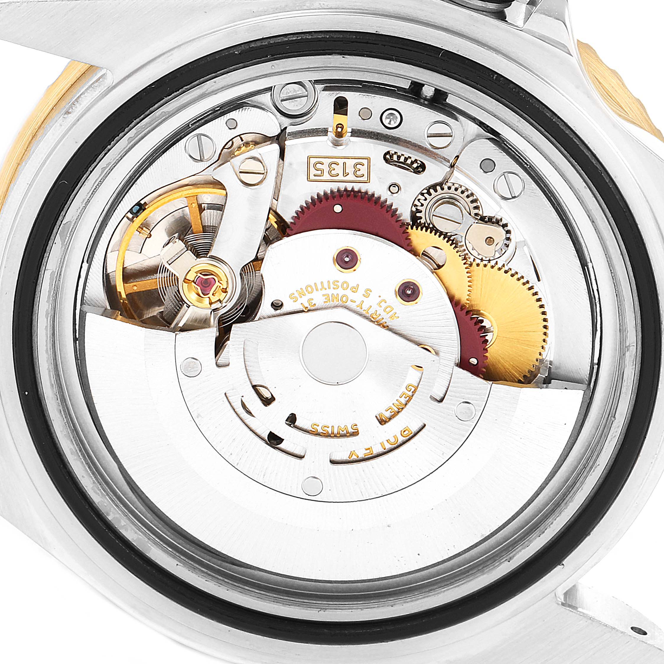 The image shows the internal mechanism and movement of the Rolex Submariner 16613 Men's Steel and Gold (two tone) Black Dial 16613 Men's Steel and Gold (two tone) Black Dial watch from a rear angle.