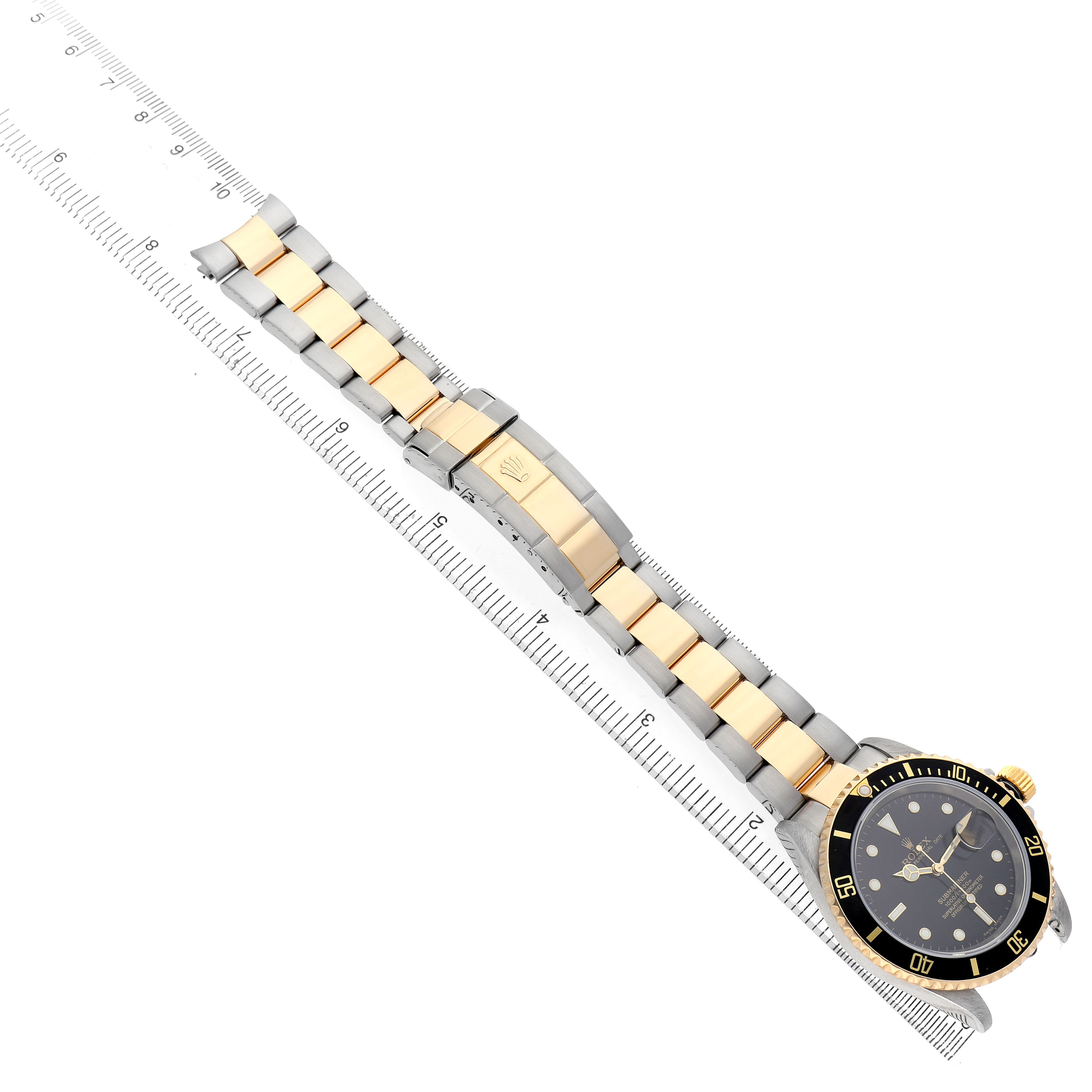 The image shows a side angle of a Rolex Submariner 16613 Men's Steel and Gold (two tone) Black Dial, displaying the watch face, bezel, and two-tone bracelet.
