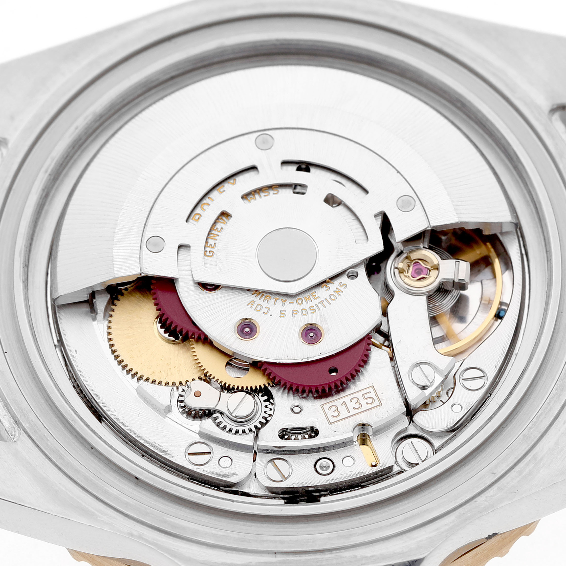 The image shows a close-up of the movement inside a Rolex Submariner 16613 Men's Steel and Gold (two tone) Black Dial, highlighting gears and intricate mechanisms.

