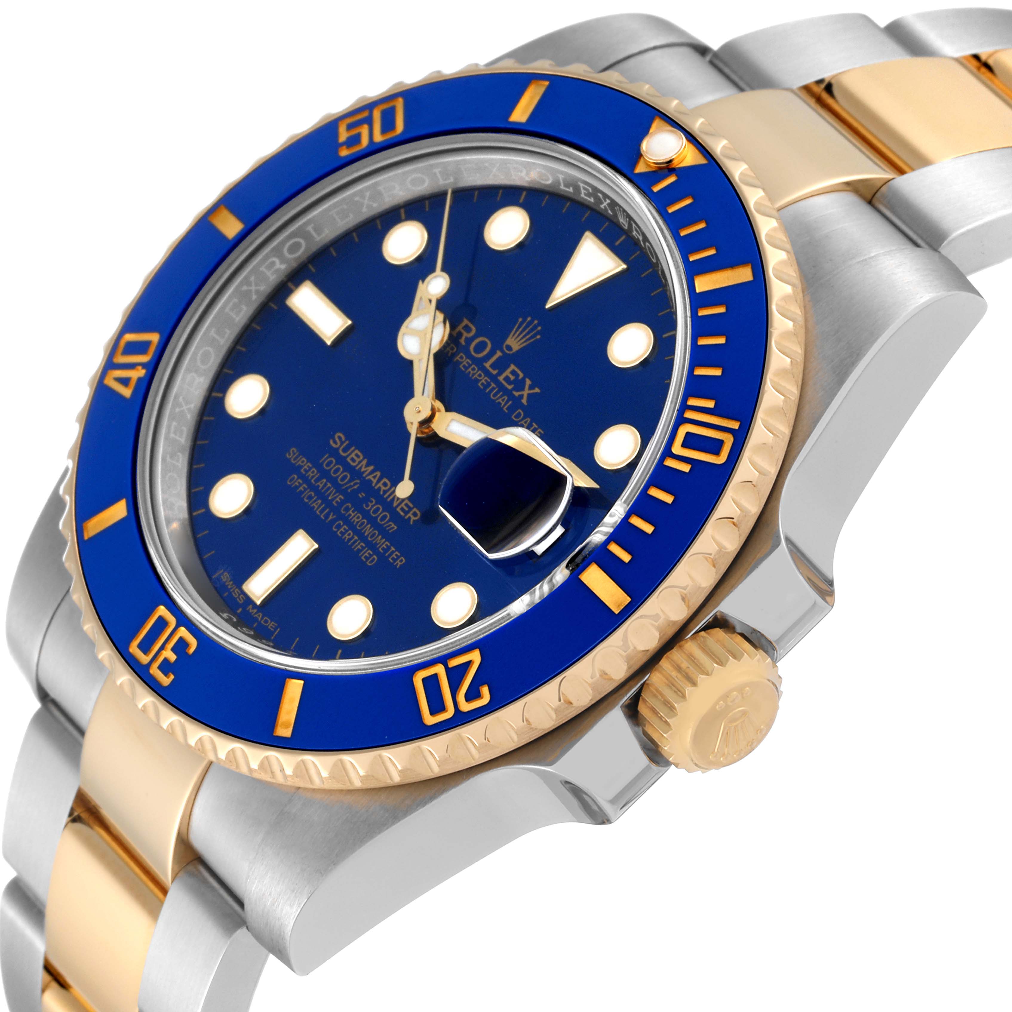 The image shows a close-up angled view of a Rolex Submariner 116613 Men's Steel and Gold (two tone) Blue Dial 116613 Men's Steel and Gold (two tone) Blue Dial, highlighting the blue dial, bezel, crown, and part of the bracelet.