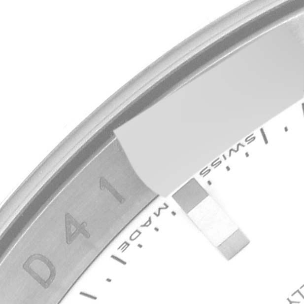 This image shows a partial top view of the bezel and edge of the dial of a Rolex Turn-o-Graph 116264 Men
s Stainless Steel White Dial 116264 Men
s Stainless Steel White Dial watch.