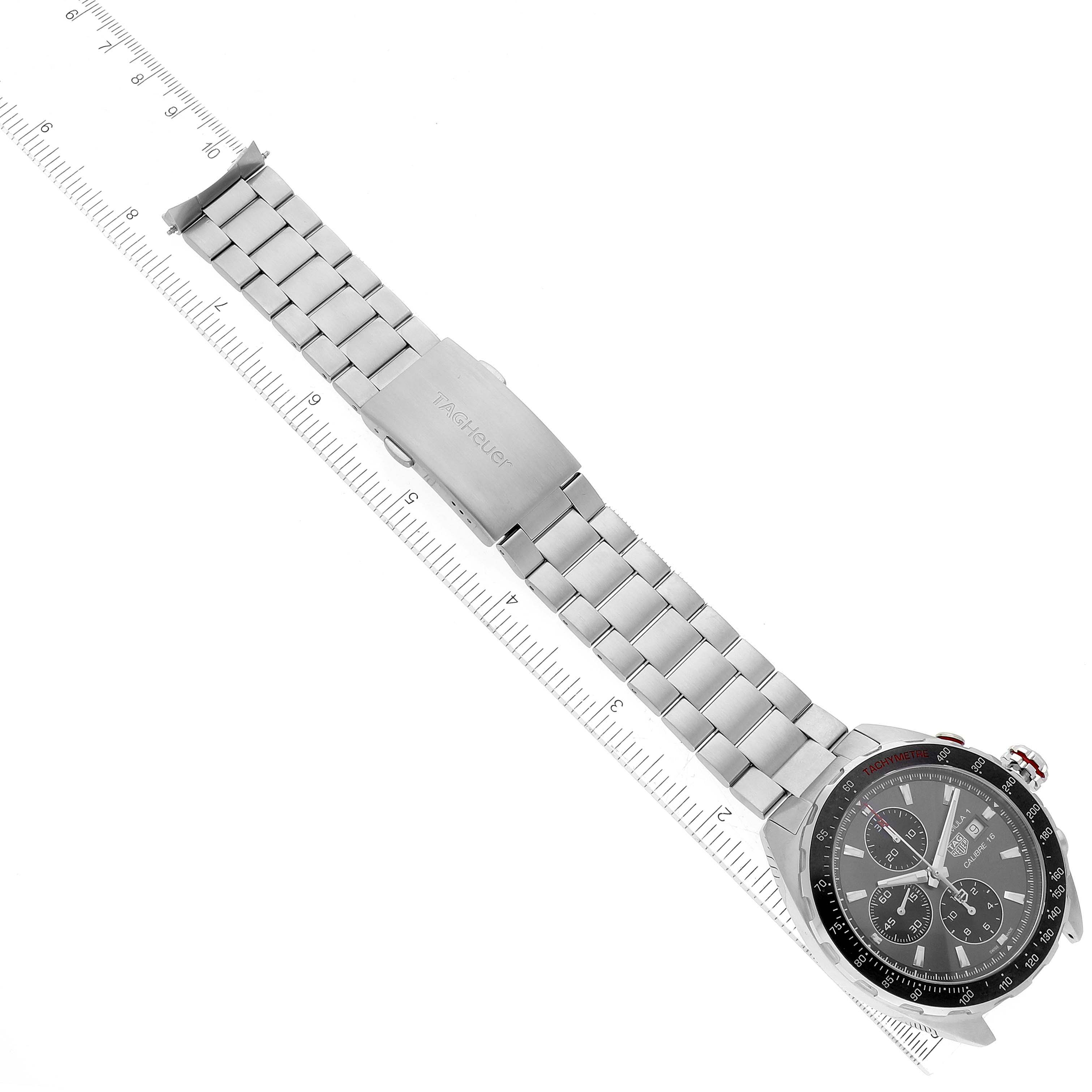 The image shows the entire Tag Heuer Formula 1 CAZ2012.BA0876 Men's Stainless Steel Grey Dial CAZ2012.BA0876 Men's Stainless Steel Grey Dial watch laid flat with its metal bracelet and clasp, measured against a ruler.