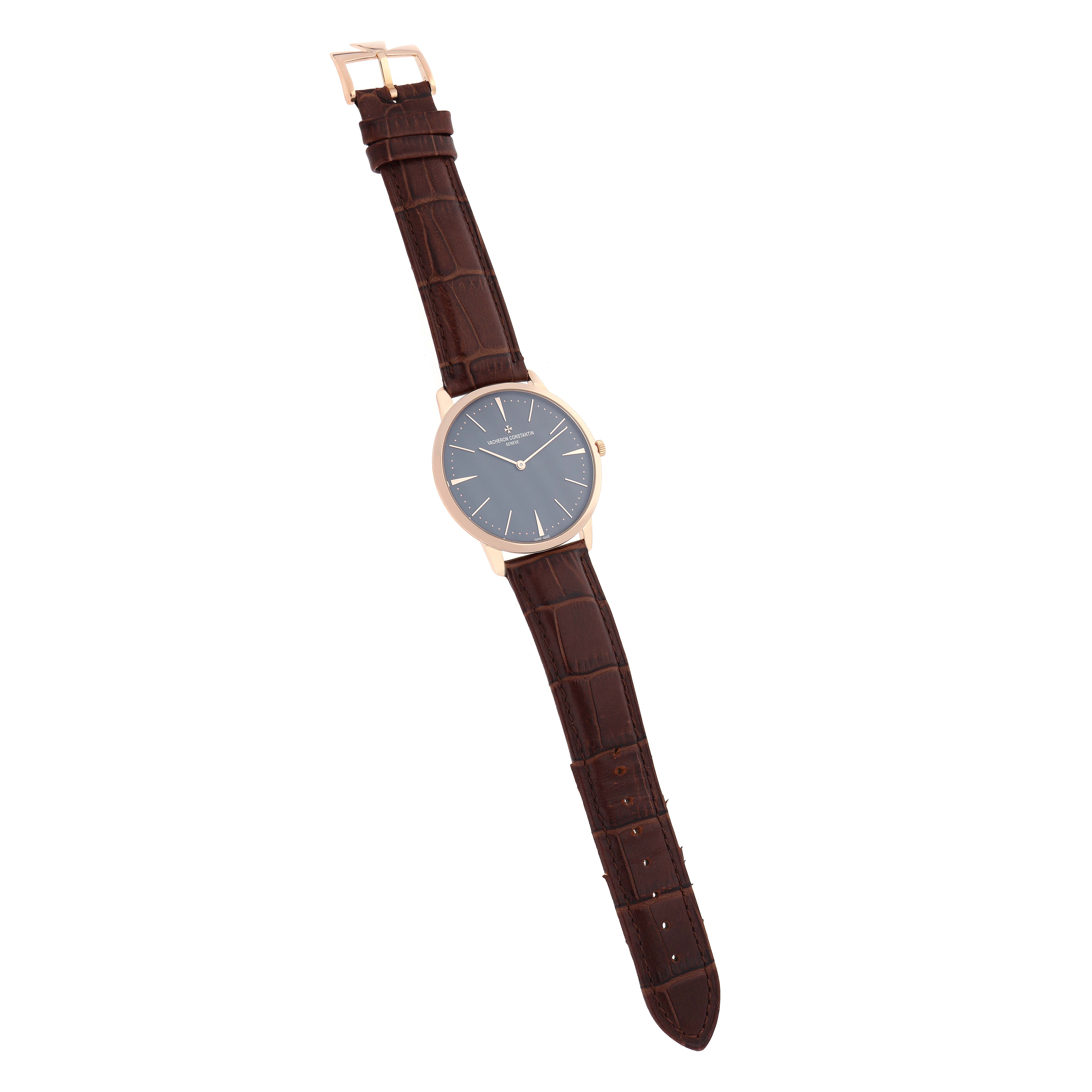 The Vacheron Constantin Patrimony 81180 Men
s Rose Gold Grey Dial watch is shown from a top-down angle, displaying its face and brown leather strap.
