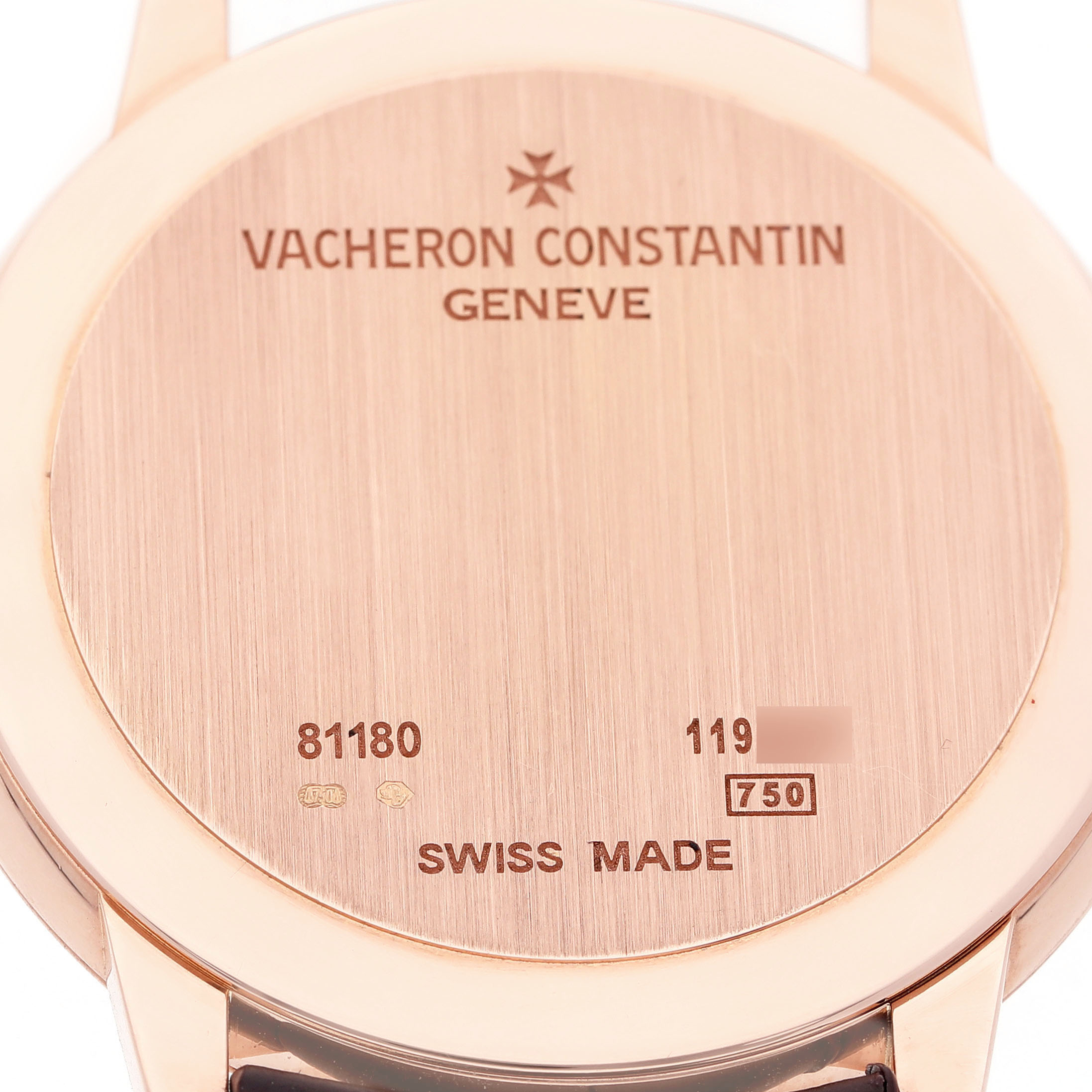 The image shows the back case of a Vacheron Constantin Patrimony 81180/000R-9159 Men's Rose Gold Silver Dial watch, highlighting its engravings and material details.