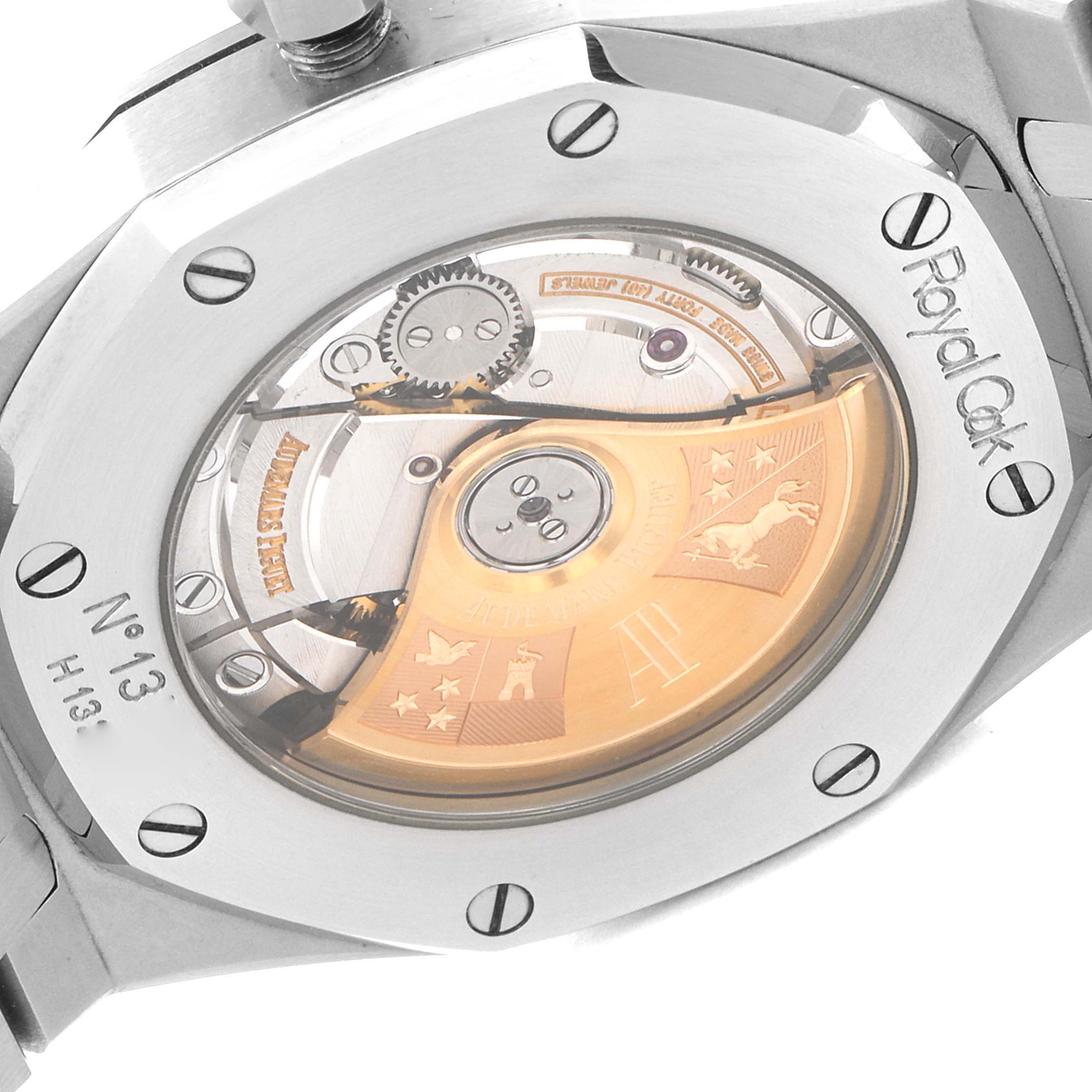 The image shows the case back of a Royal Oak watch by Audemars Piguet, revealing its intricate movement.