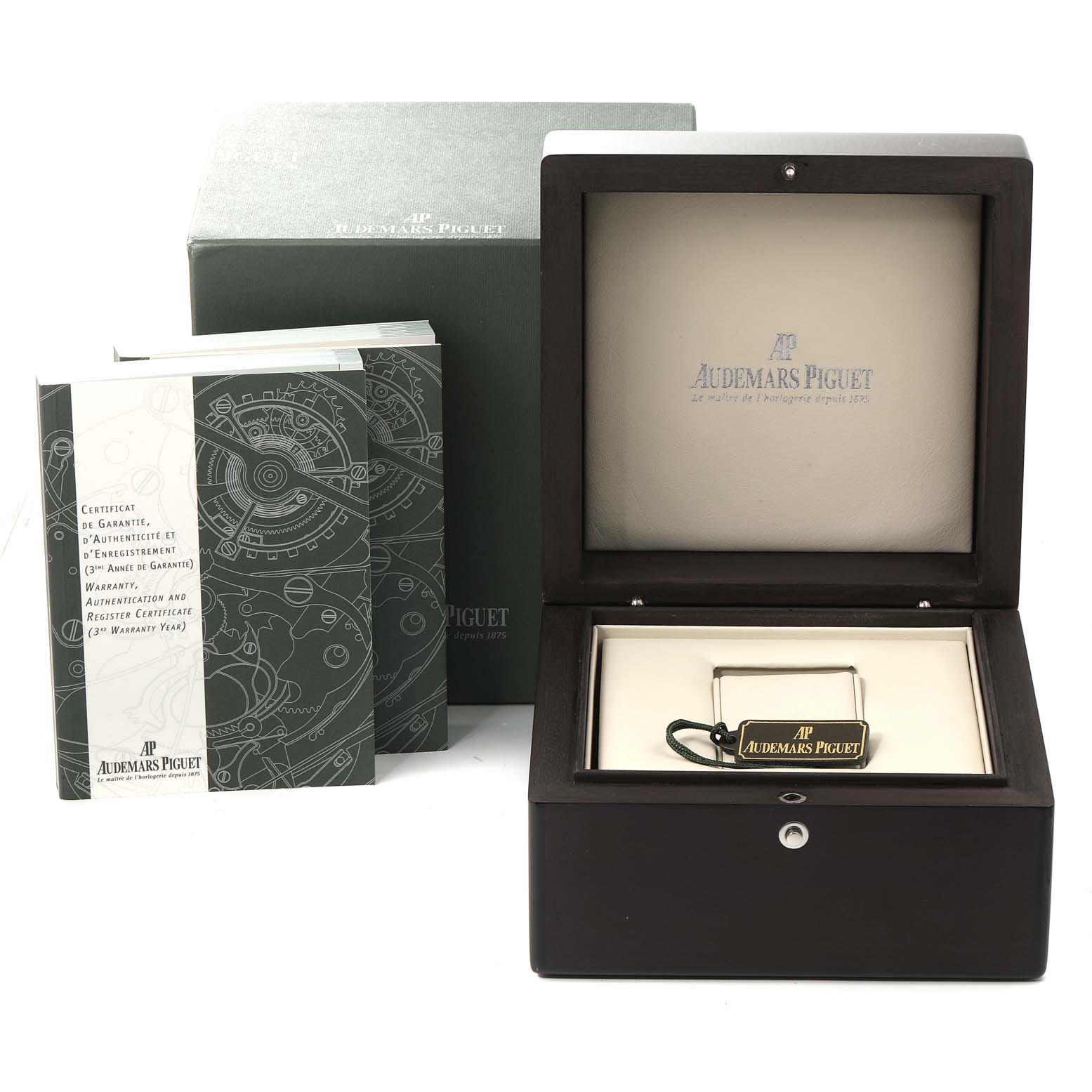 This image shows the packaging and accessories for a Royal Oak model watch by Audemars Piguet, including its box and manuals.