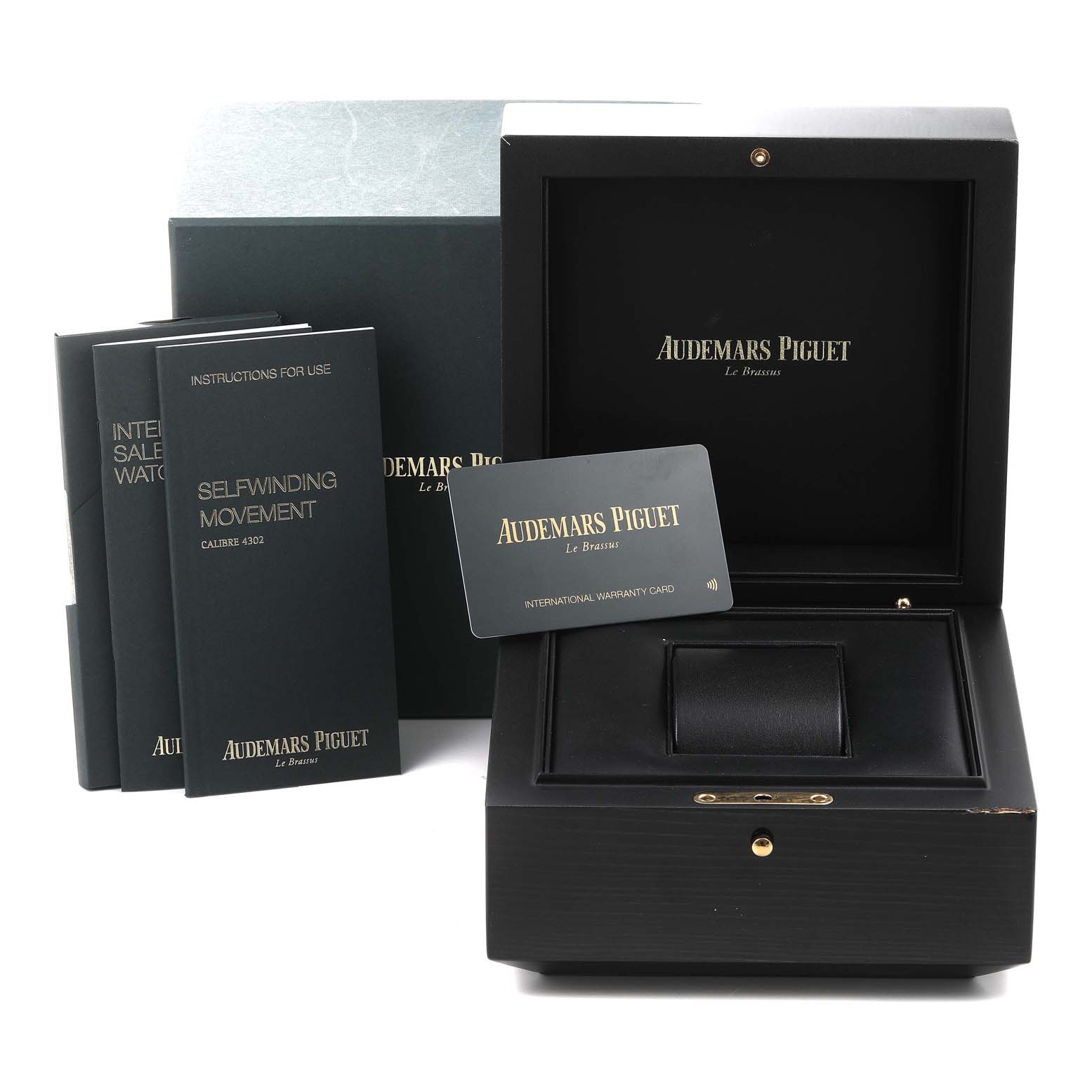 The image shows an Audemars Piguet Royal Oak 15500ST.OO.1220ST.03 Men's Stainless Steel Black Dial 15500ST.OO.1220ST.03 Men's Stainless Steel Black Dial watch box, warranty card, and manuals, photographed from the front.