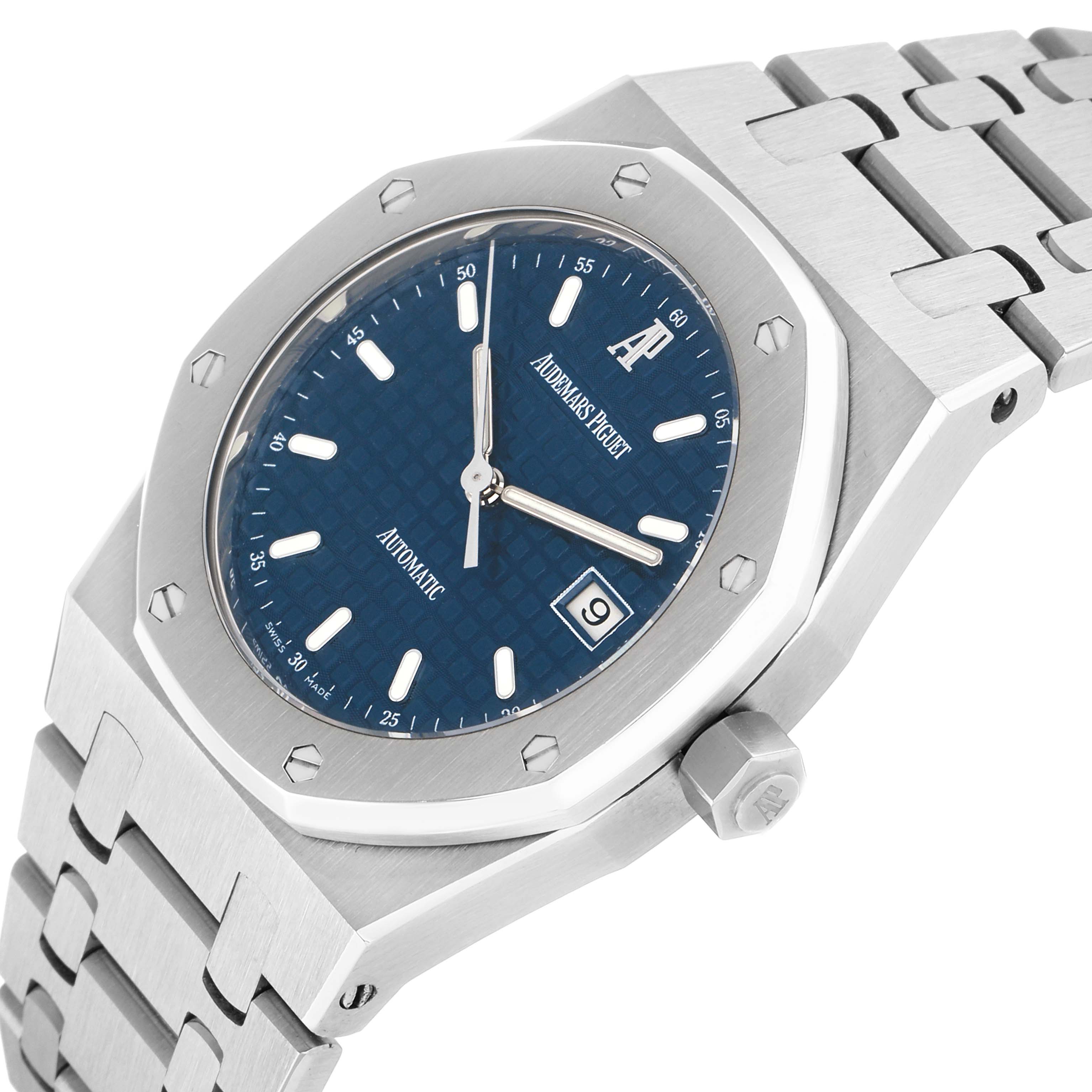 The image shows the Audemars Piguet Royal Oak 15000ST Men
s Stainless Steel Blue Dial watch at an angled view, highlighting the case, bezel, dial, bracelet, and crown.