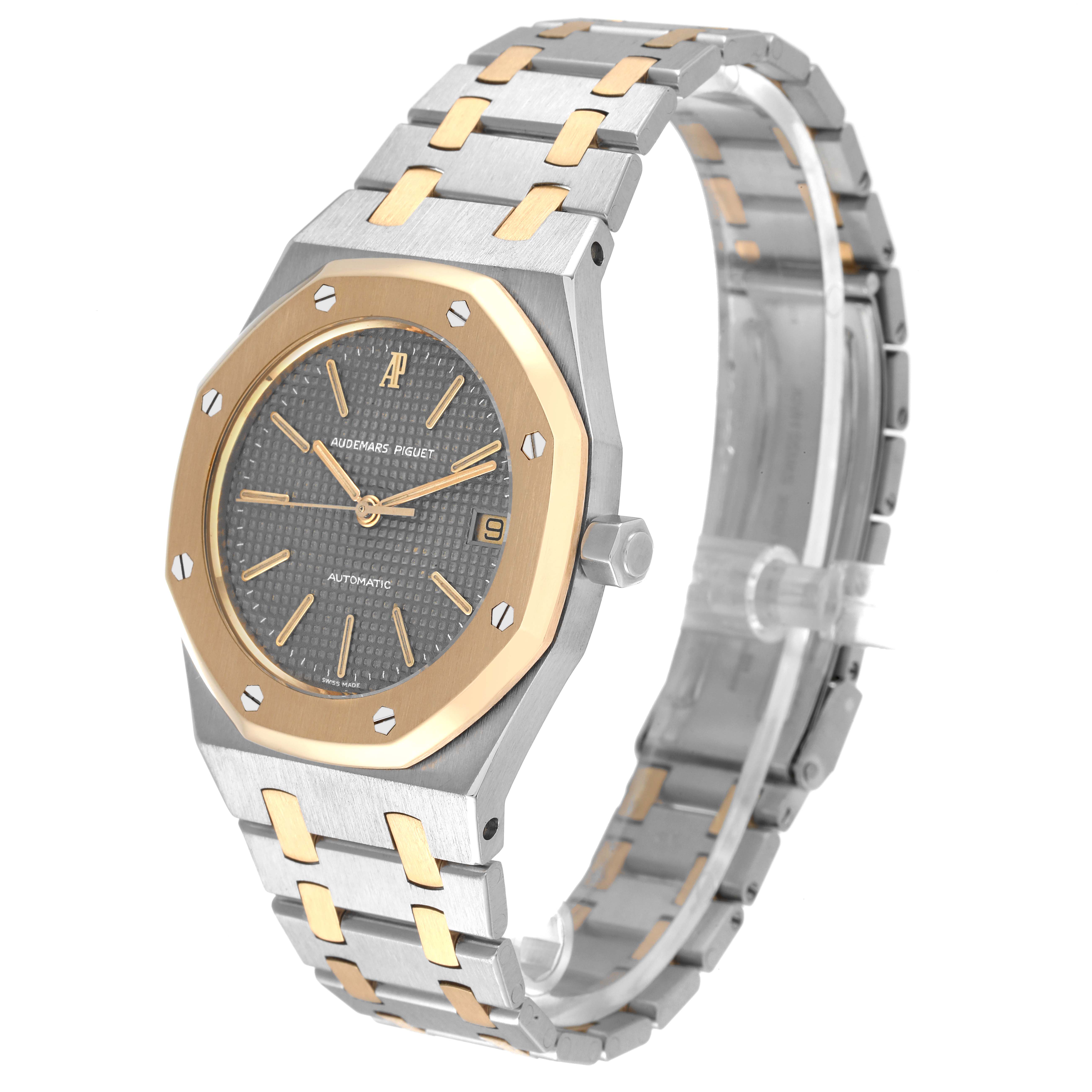 The image shows a side and front view of an Audemars Piguet Royal Oak 14100SA Men's Steel and Gold (two tone) Grey Dial 14100SA Men's Steel and Gold (two tone) Grey Dial watch, revealing its two-tone bracelet and octagonal bezel.