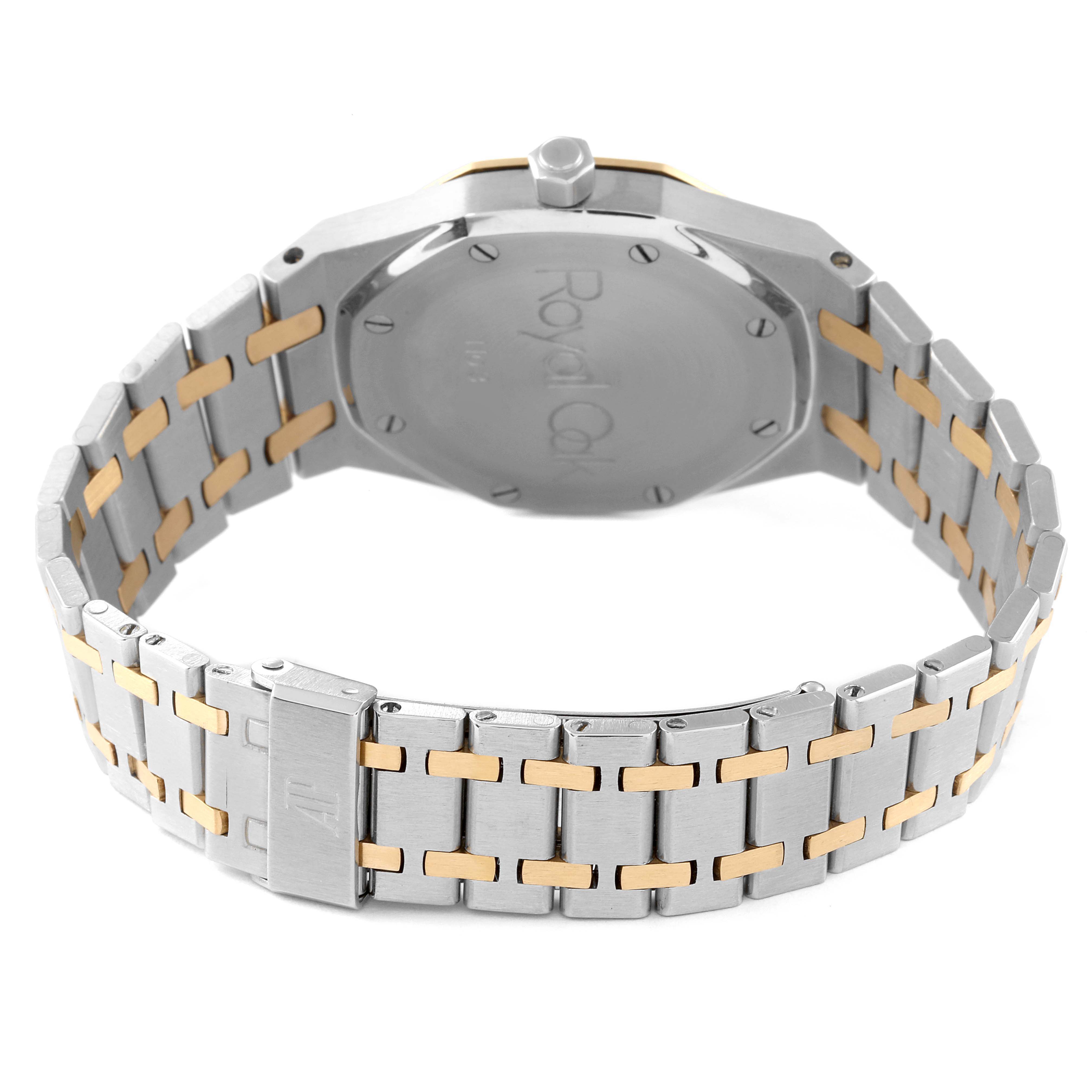 The image shows the back view of the Audemars Piguet Royal Oak 14100SA Men's Steel and Gold (two tone) Grey Dial 14100SA Men's Steel and Gold (two tone) Grey Dial watch, focusing on its case back and bracelet.