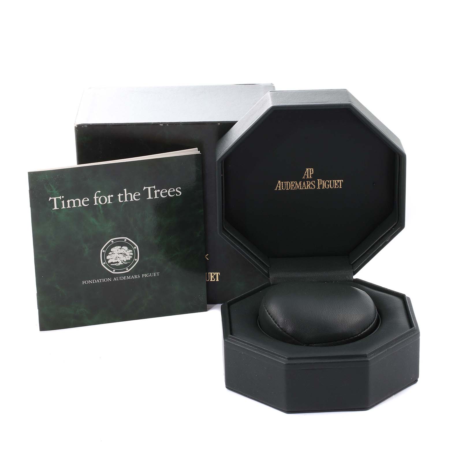 This image shows an open box for a Royal Oak by Audemars Piguet, along with an information booklet and outer packaging.