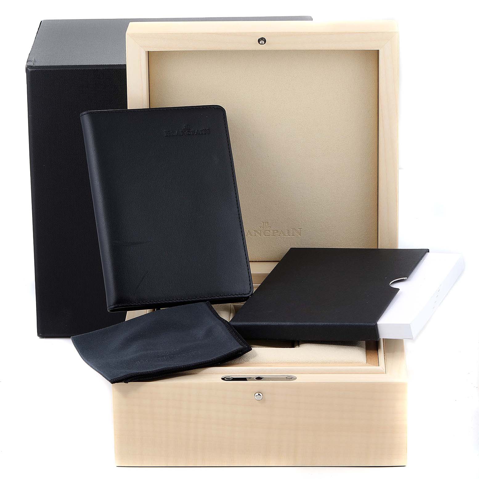 The image shows the open box and accessories for the Blancpain Villeret 6654-1127-55B Men's Stainless Steel Silver Dial 6654-1127-55B Men's Stainless Steel Silver Dial watch, including booklets and a black pouch.