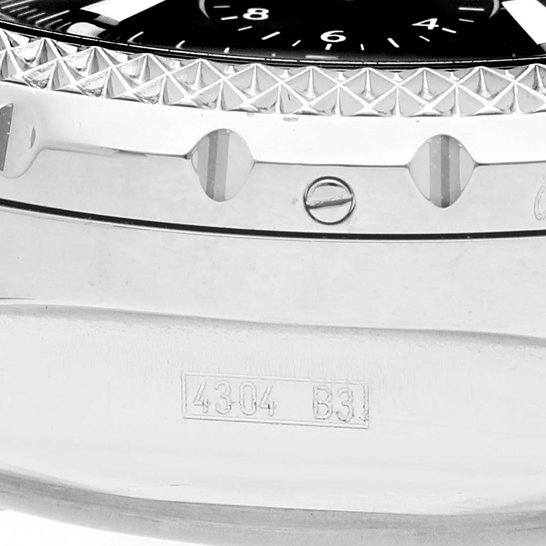 This close-up image of the Breitling Bentley A44362 Men's Stainless Steel Black Dial A44362 Men's Stainless Steel Black Dial watch shows the bezel, part of the dial, and engraved markings on the case side.