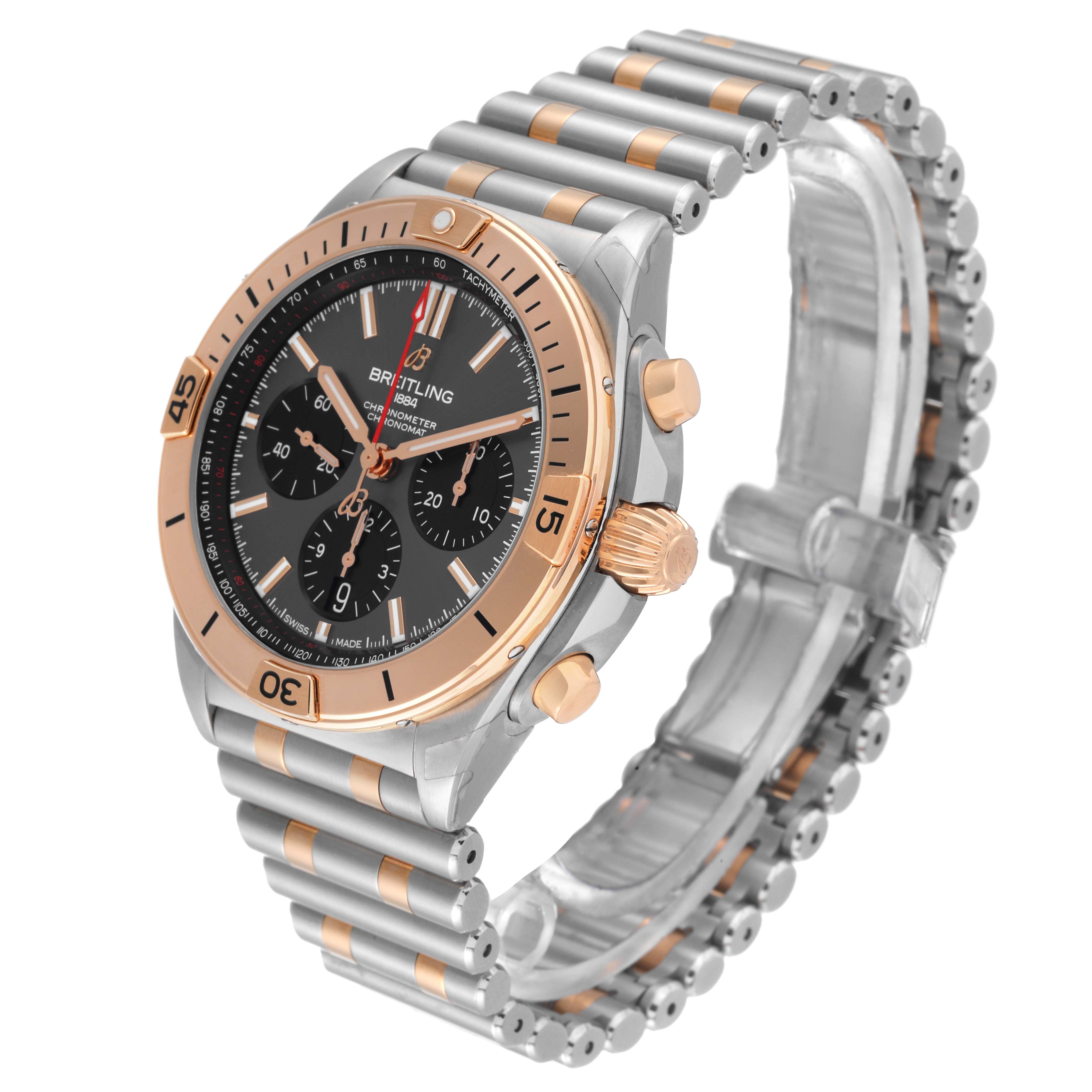 This image shows a side angle of the Breitling Chronomat UB0134 Men's Steel and Gold (two tone) Grey Dial UB0134 Men's Steel and Gold (two tone) Grey Dial watch, highlighting its bezel, crown, buttons, and bracelet.