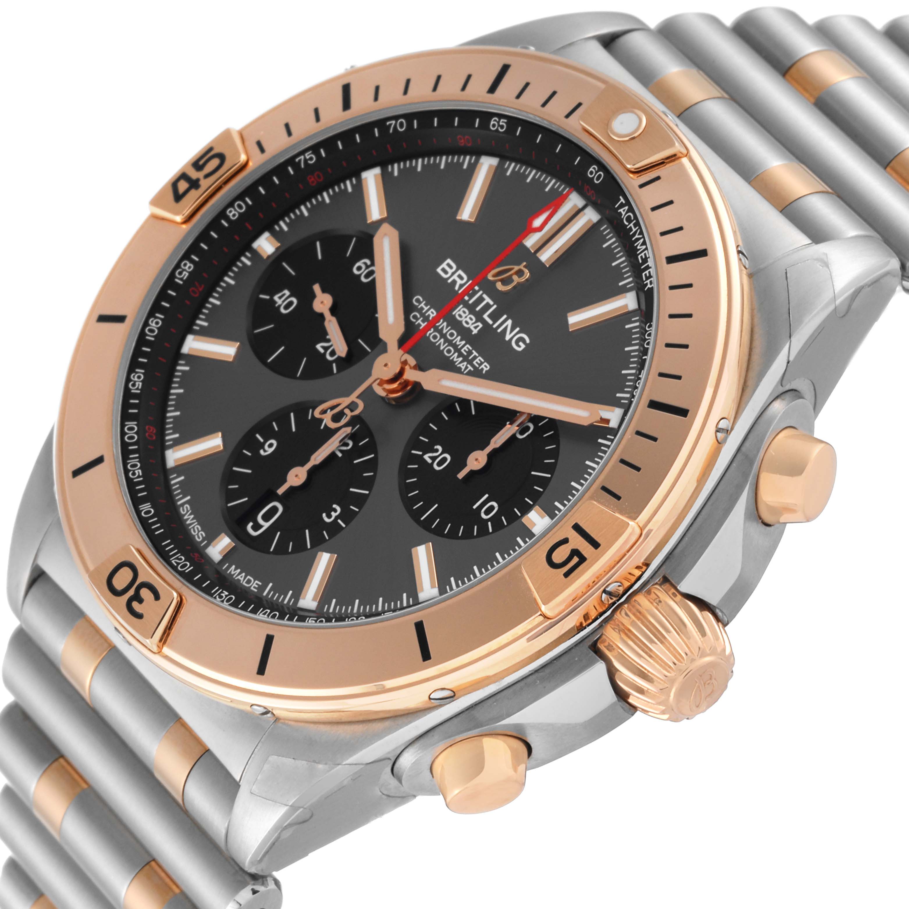 The Breitling Chronomat UB0134 Men's Steel and Gold (two tone) Grey Dial UB0134 Men's Steel and Gold (two tone) Grey Dial watch is shown at an angled close-up, highlighting the face, bezel, crown, and part of the metal strap.