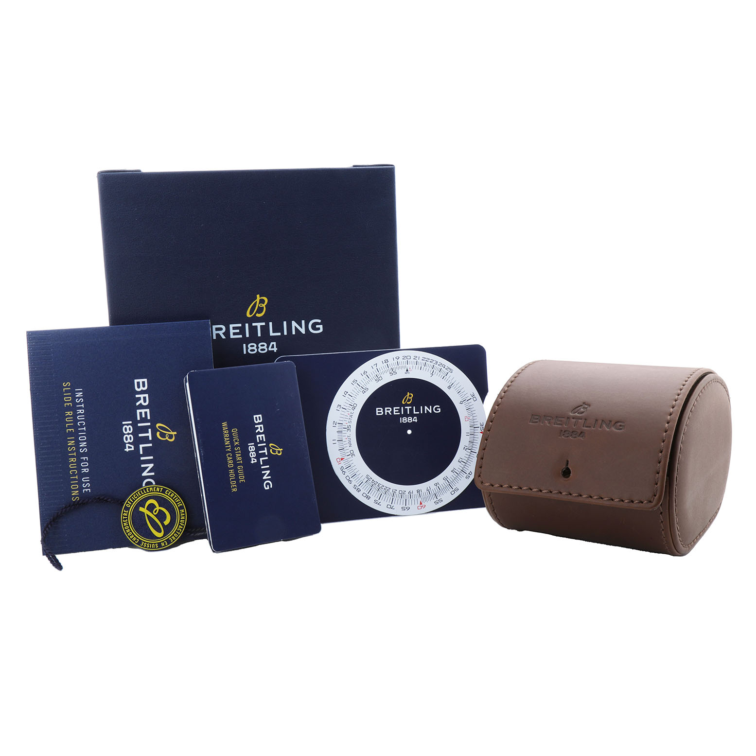 The image shows a Breitling Navitimer A17325 Men's Stainless Steel Blue Dial watch accessory set, including a box, manuals, a circular slide rule, and a leather case.