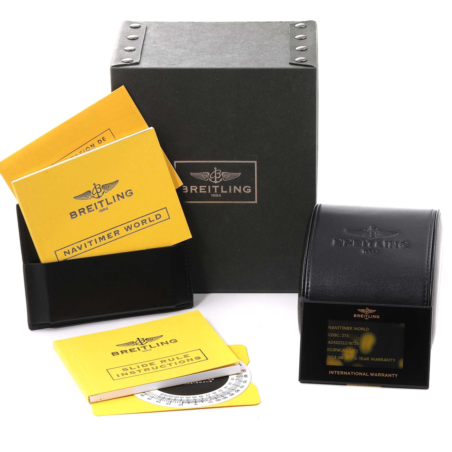 The image shows the packaging, manuals, warranty card, and accessories for a Breitling Navitimer A24322 Men
s Stainless Steel Black Dial A24322 Men
s Stainless Steel Black Dial watch.