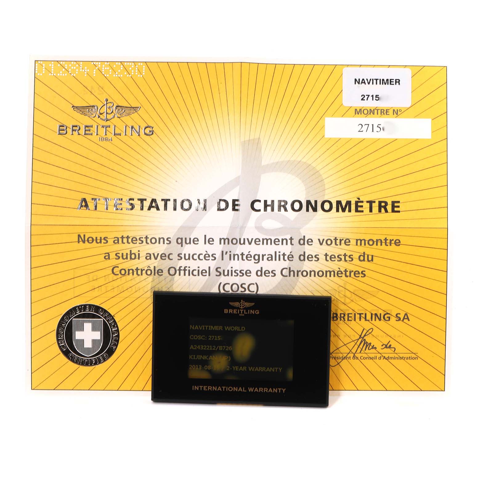 The image shows a Breitling Navitimer A24322 Men
s Stainless Steel Black Dial A24322 Men
s Stainless Steel Black Dial model
s chronometer certificate and international warranty card.