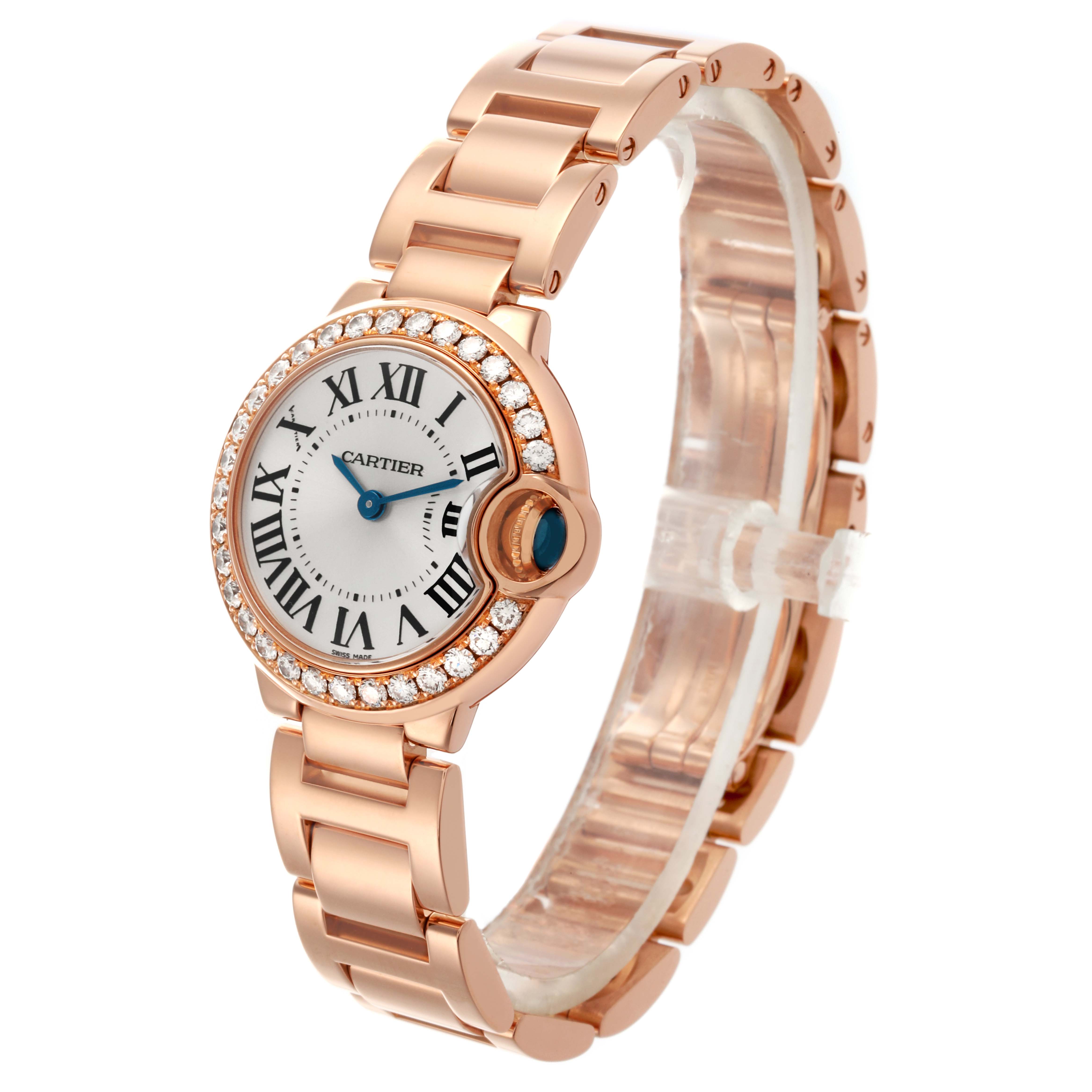 The Cartier Ballon Bleu WE9002Z3 Women's Rose Gold Silver Dial WE9002Z3 Women's Rose Gold Silver Dial watch is shown from a side angle, highlighting the dial, Roman numerals, and bracelet design.