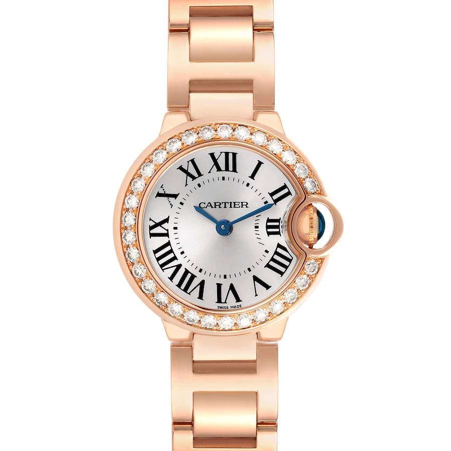 The Cartier Ballon Bleu watch is shown from the front, highlighting the face, bezel with diamonds, and part of the bracelet.