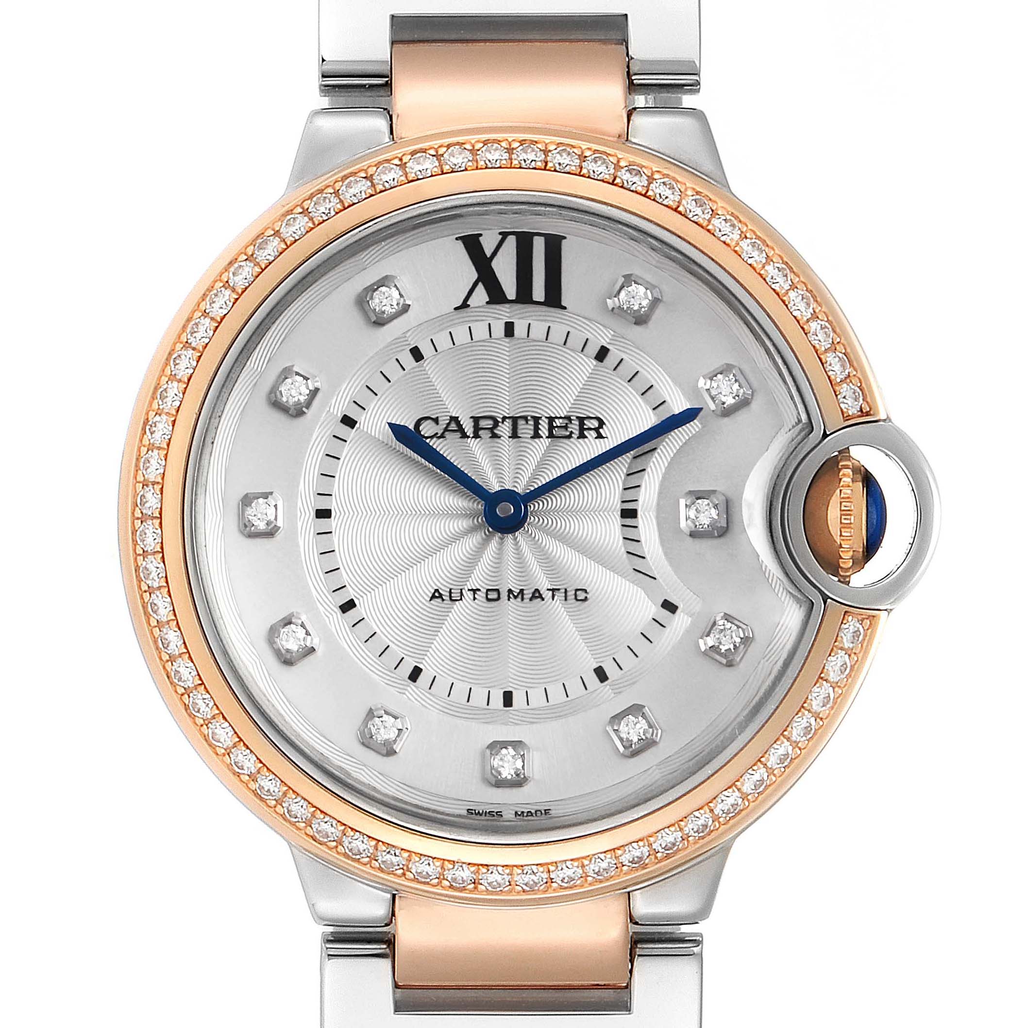 The image shows the face of a Cartier Ballon Bleu WE902078 Women's Rose Gold Silver Dial WE902078 Women's Rose Gold Silver Dial watch featuring a two-tone band, diamond hour markers, and a blue sapphire crown.