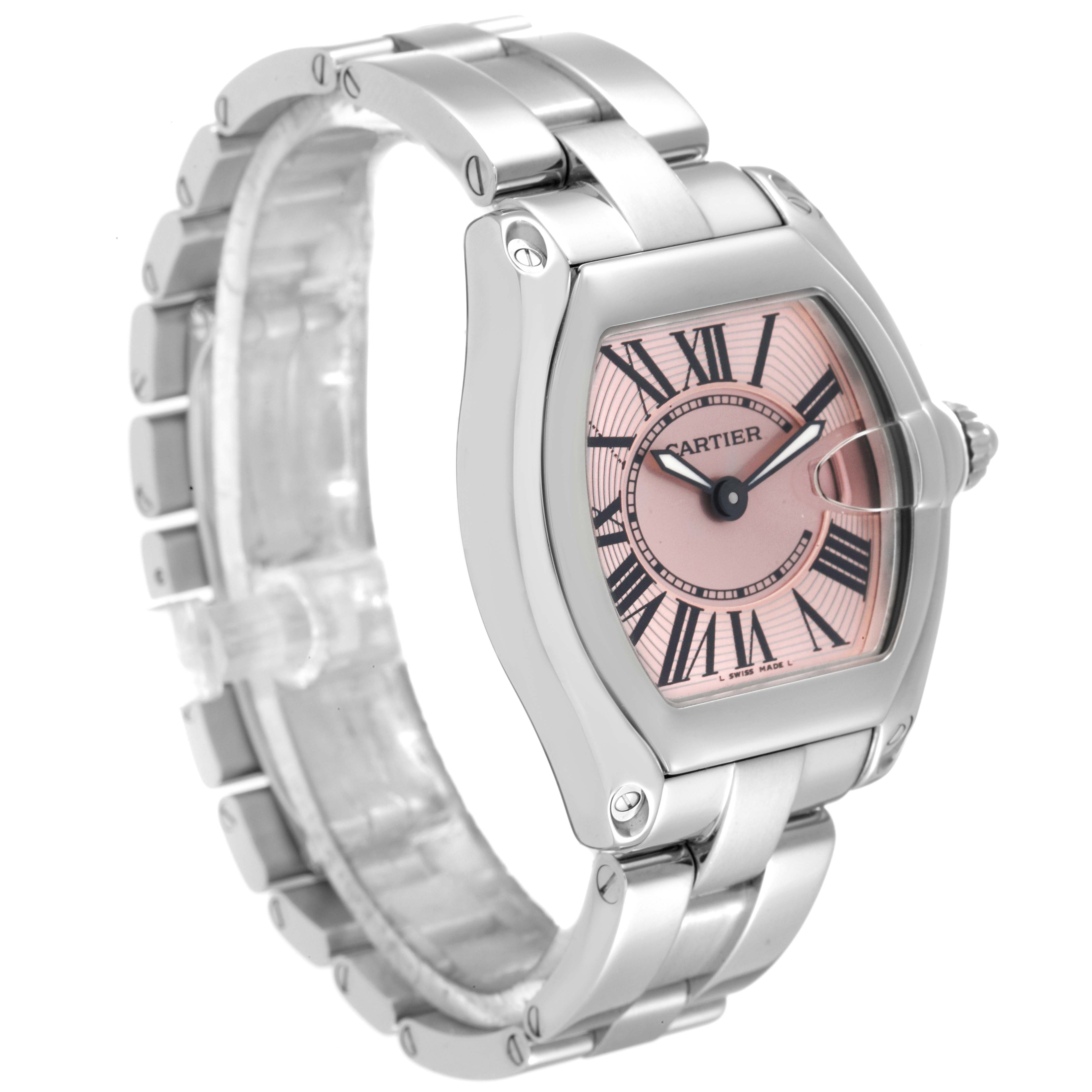 This Cartier Roadster W62017V3 Women's Stainless Steel Pink Dial W62017V3 Women's Stainless Steel Pink Dial watch is shown from a three-quarter view, highlighting its pink dial, links, case, and crown.