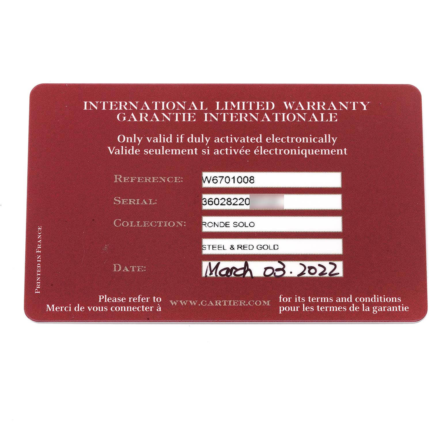 This image shows the International Limited Warranty card for a Cartier Ronde W6701008 Men
s Steel and Gold (two tone) Silver Dial W6701008 Men
s Steel and Gold (two tone) Silver Dial Solo watch, indicating reference, serial number, and date of purchase.