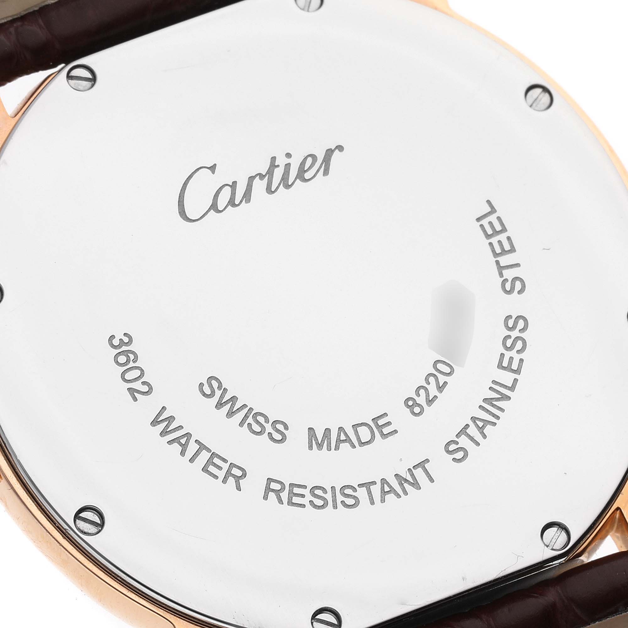 The image shows the back case of the Ronde model by Cartier, highlighting its stainless steel and water-resistant properties.