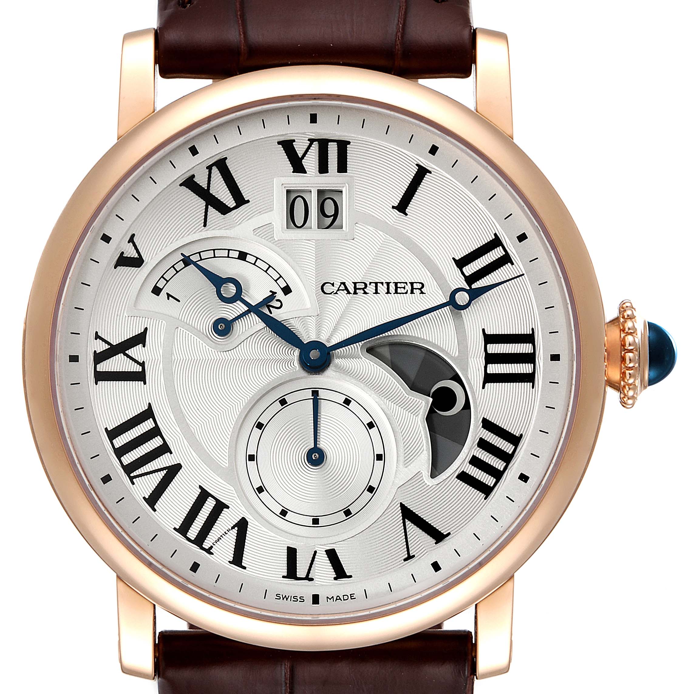 The image shows a front view of a Cartier Rotonde W1556240 Men's Rose Gold Silver Dial W1556240 Men's Rose Gold Silver Dial model watch, displaying its dial and crown with a blue gemstone.