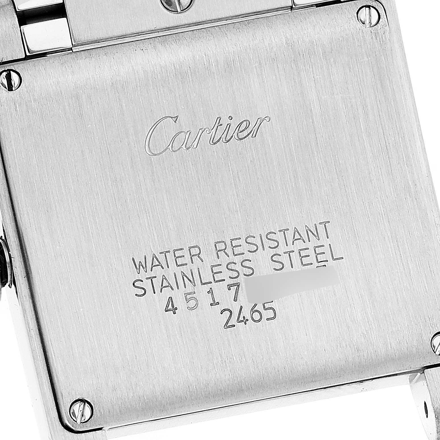 The image shows the back case of a Cartier Tank Francaise W51012Q4 Women's Steel and Gold (two tone) Silver Dial W51012Q4 Women's Steel and Gold (two tone) Silver Dial watch, highlighting the engravings and screws.