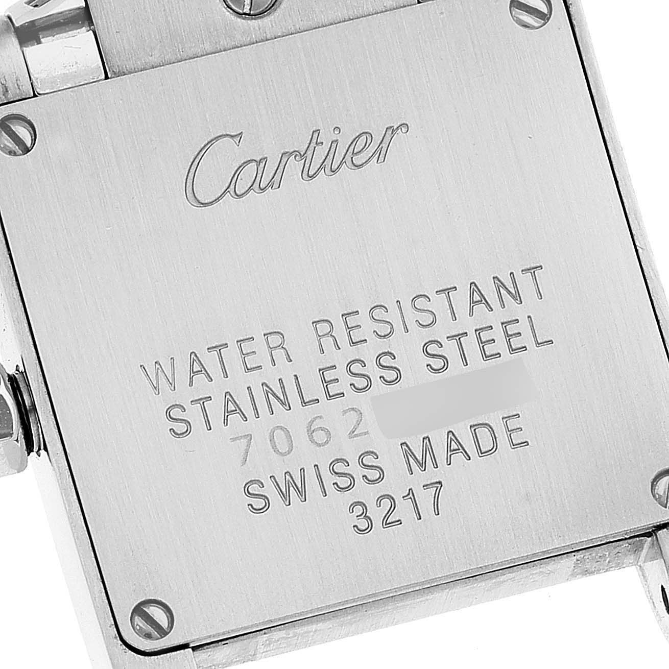 The image shows the case back of a Cartier Tank Francaise W51028Q3 Women's Stainless Steel Mother of Pearl Dial W51028Q3 Women's Stainless Steel Mother of Pearl Dial watch, displaying its engraved brandname and specifications.