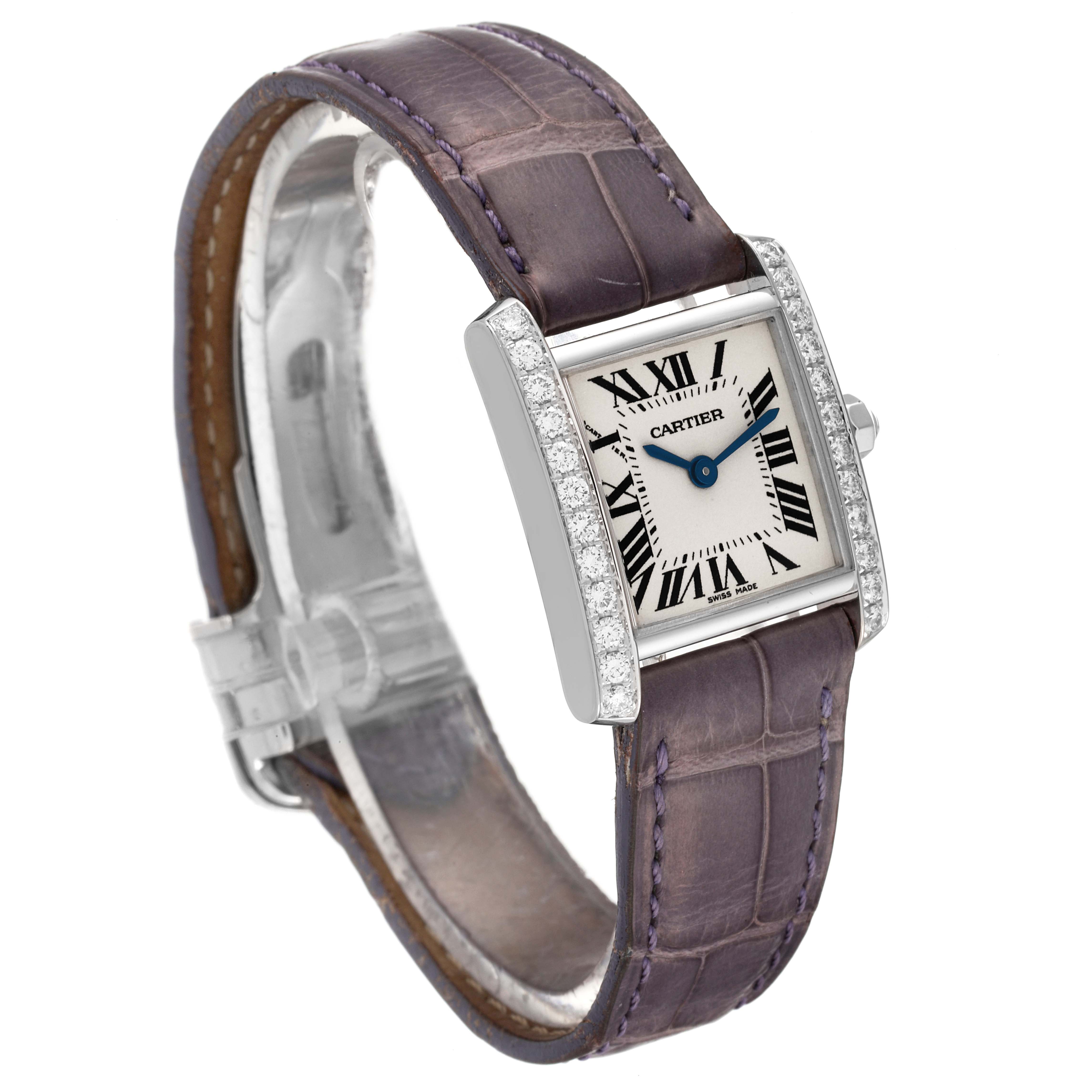 This Cartier Tank Française watch is shown at an angled side view, highlighting its face, purple alligator strap, and diamond-studded bezel.