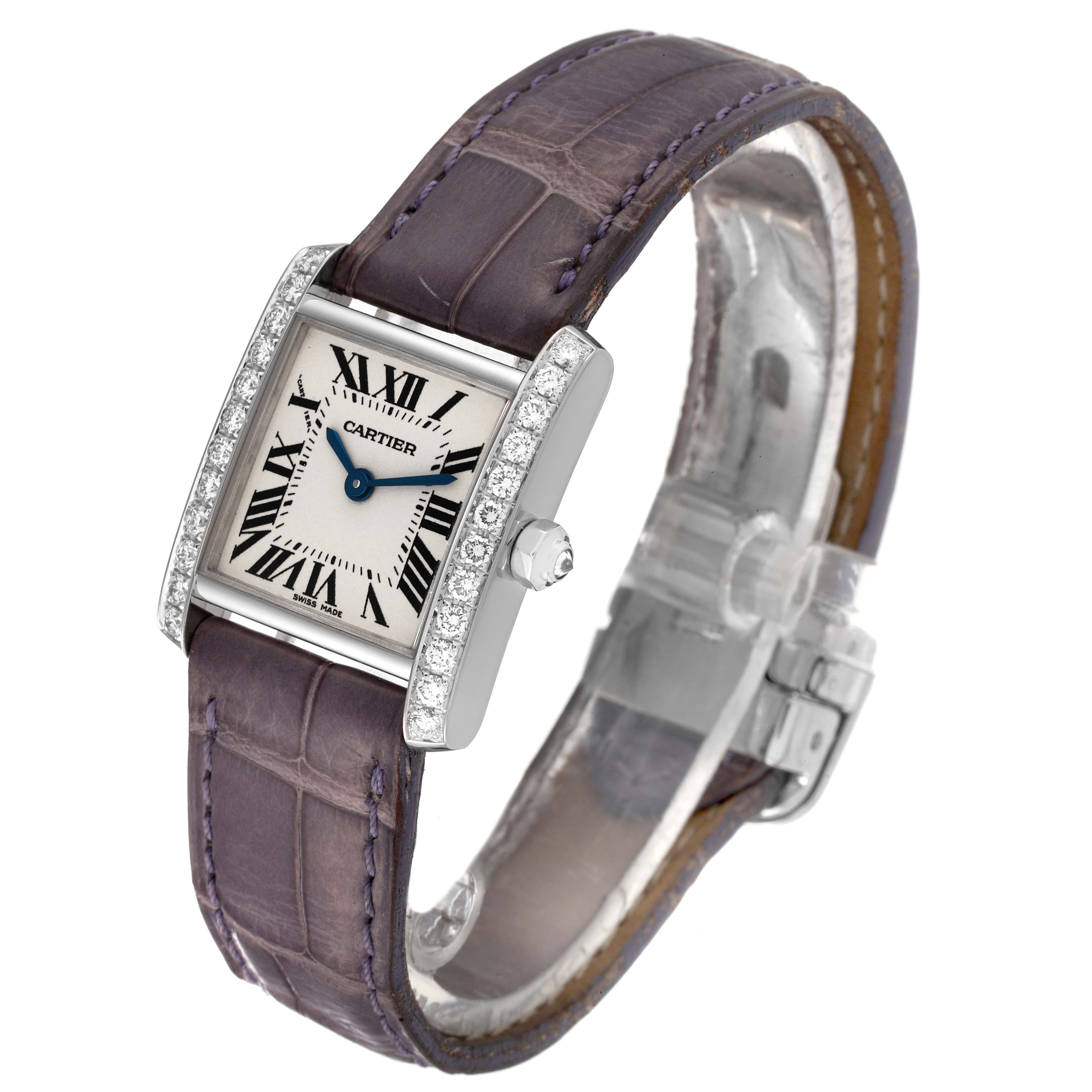 The image shows a Cartier Tank Française watch angled to display the face, strap, and jeweled bezel.