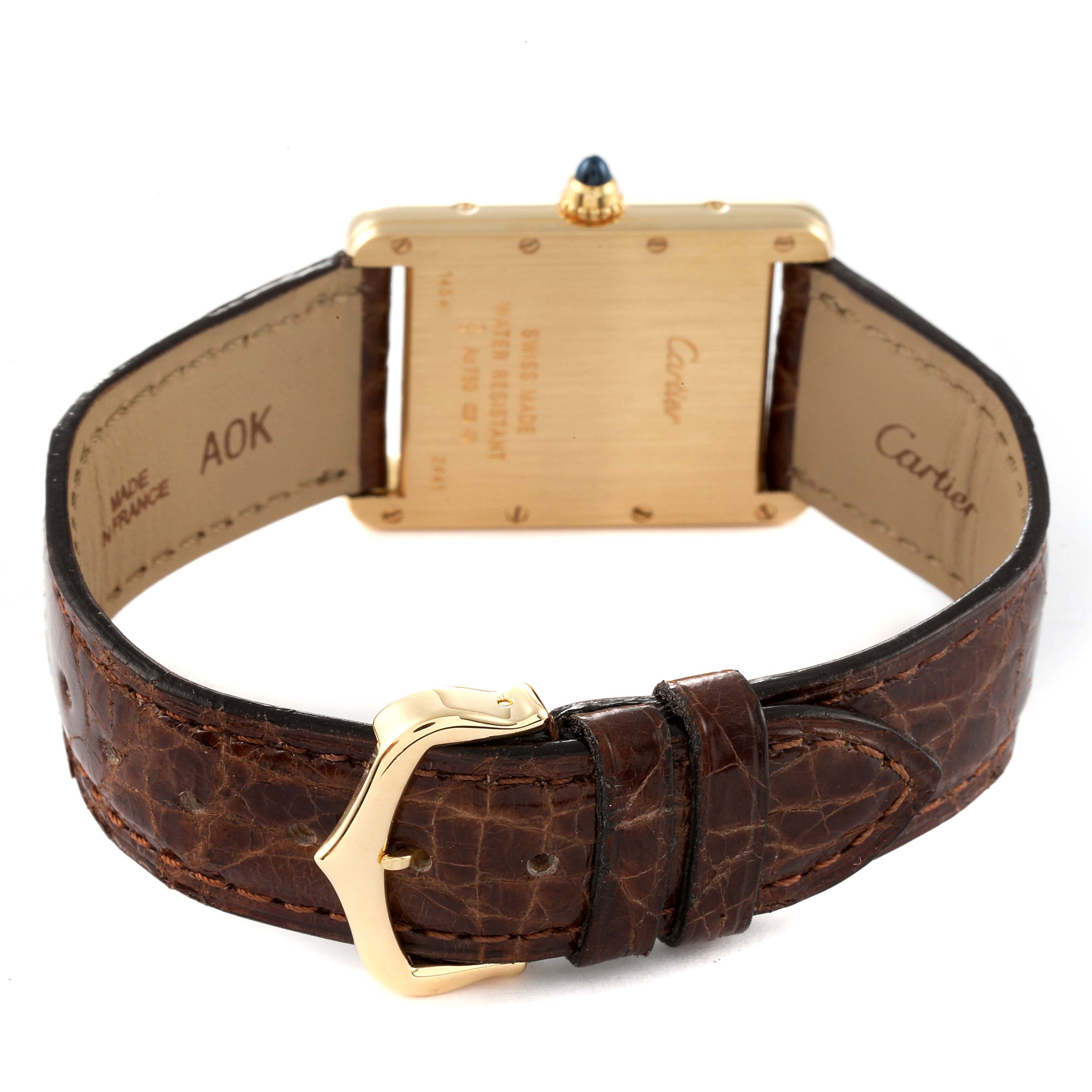 The image shows the back of a Cartier Tank Louis W1529756 Men
s Yellow Gold Silver Dial W1529756 Men
s Yellow Gold Silver Dial watch, highlighting the strap, buckle, and case back.