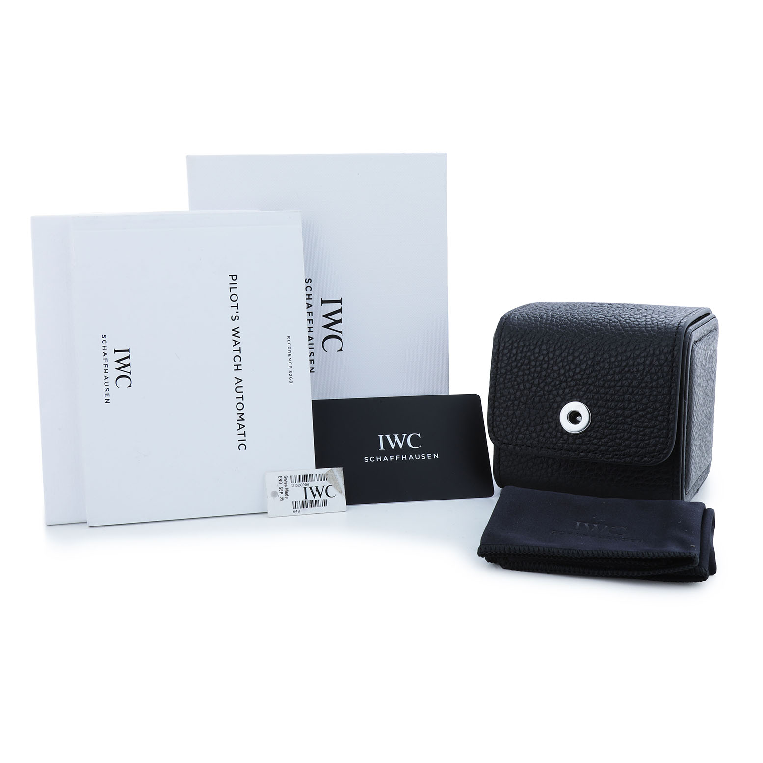 The image shows the IWC Pilot 84738 Men's Ceramic Black Dial model accessories, including a case, manuals, a card, and a cloth, displayed frontally.