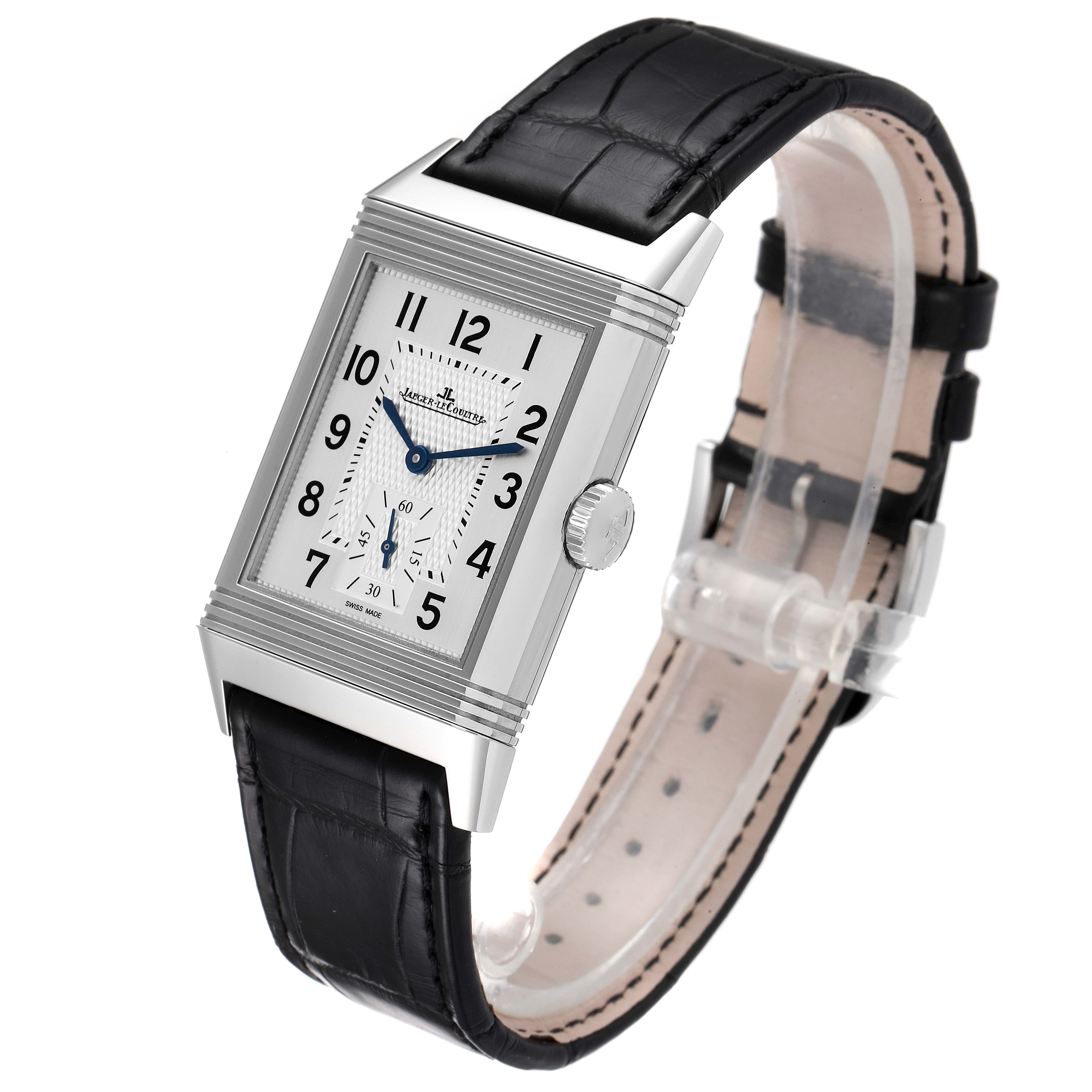 This Reverso model by Jaeger LeCoultre is shown from a high-angle view, displaying its rectangular face and black leather strap.