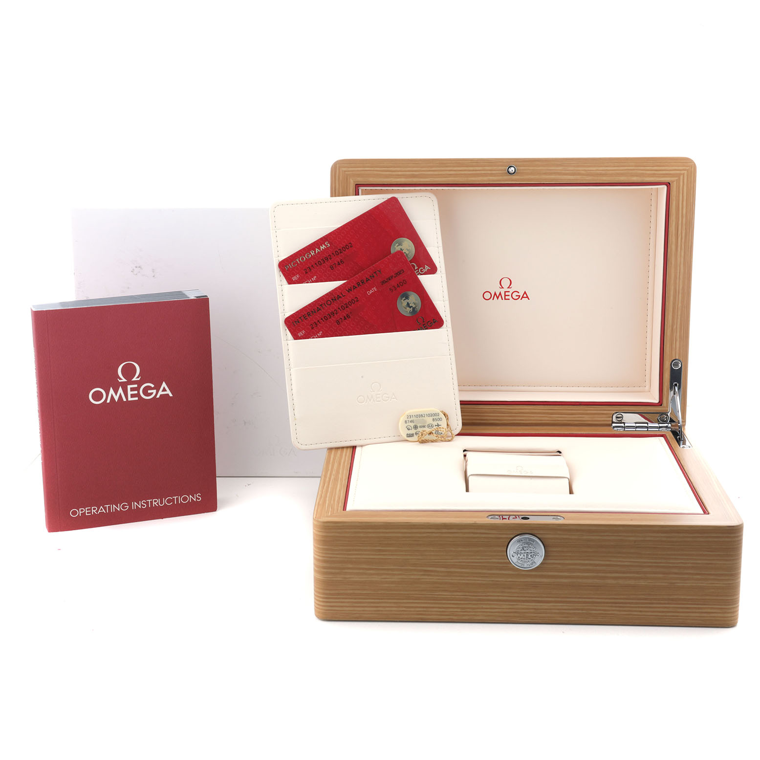 The image shows the Omega Seamaster 231.10.39.21.02.002 Men's Stainless Steel Silver Dial box, warranty cards, and operating instructions.
